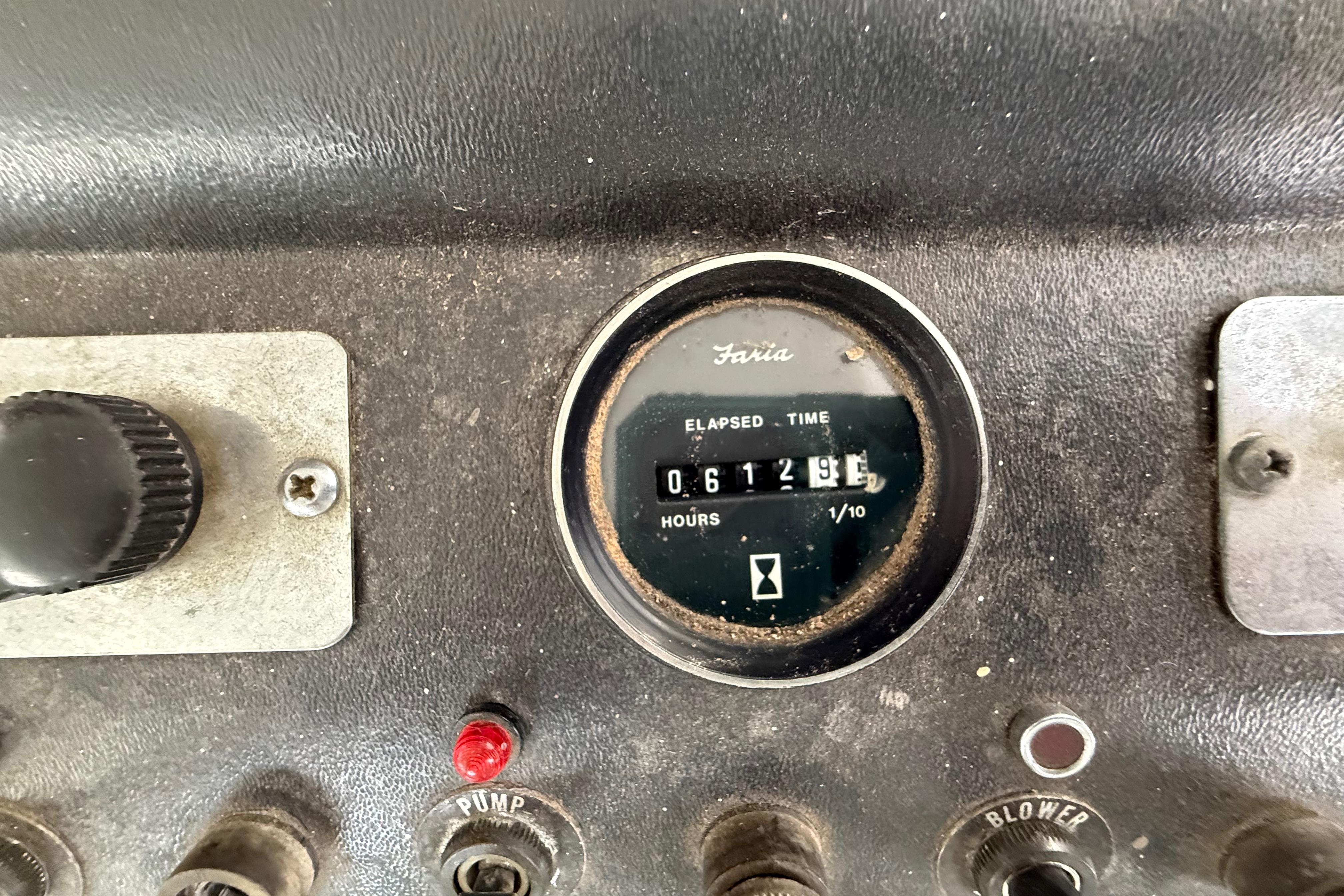 1983 Holiday Mansion 37 Barracuda dashboard with elapsed time gauge and control switches.