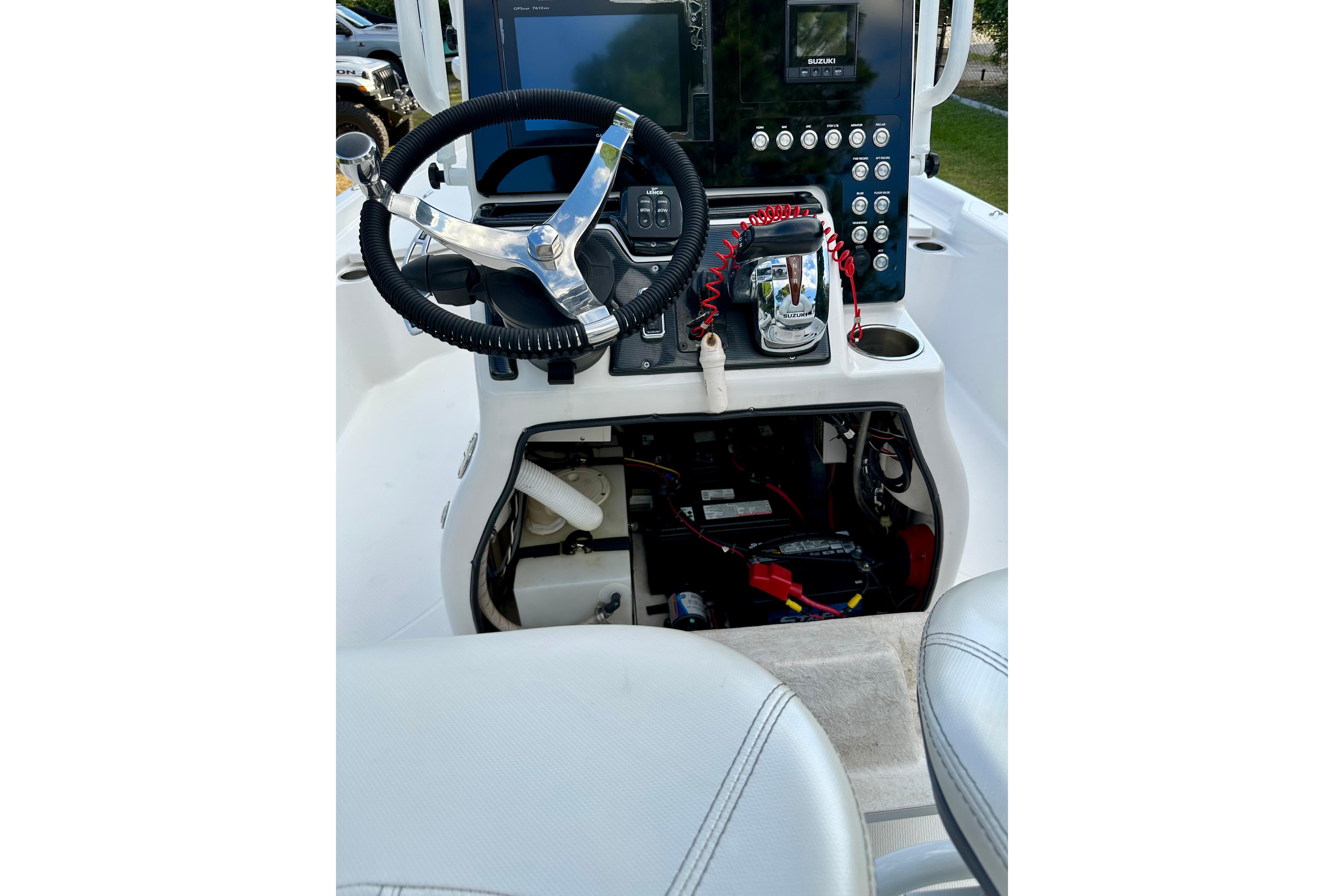 2017 Blue Wave 2400 PureBay boat console with steering wheel and control panel.