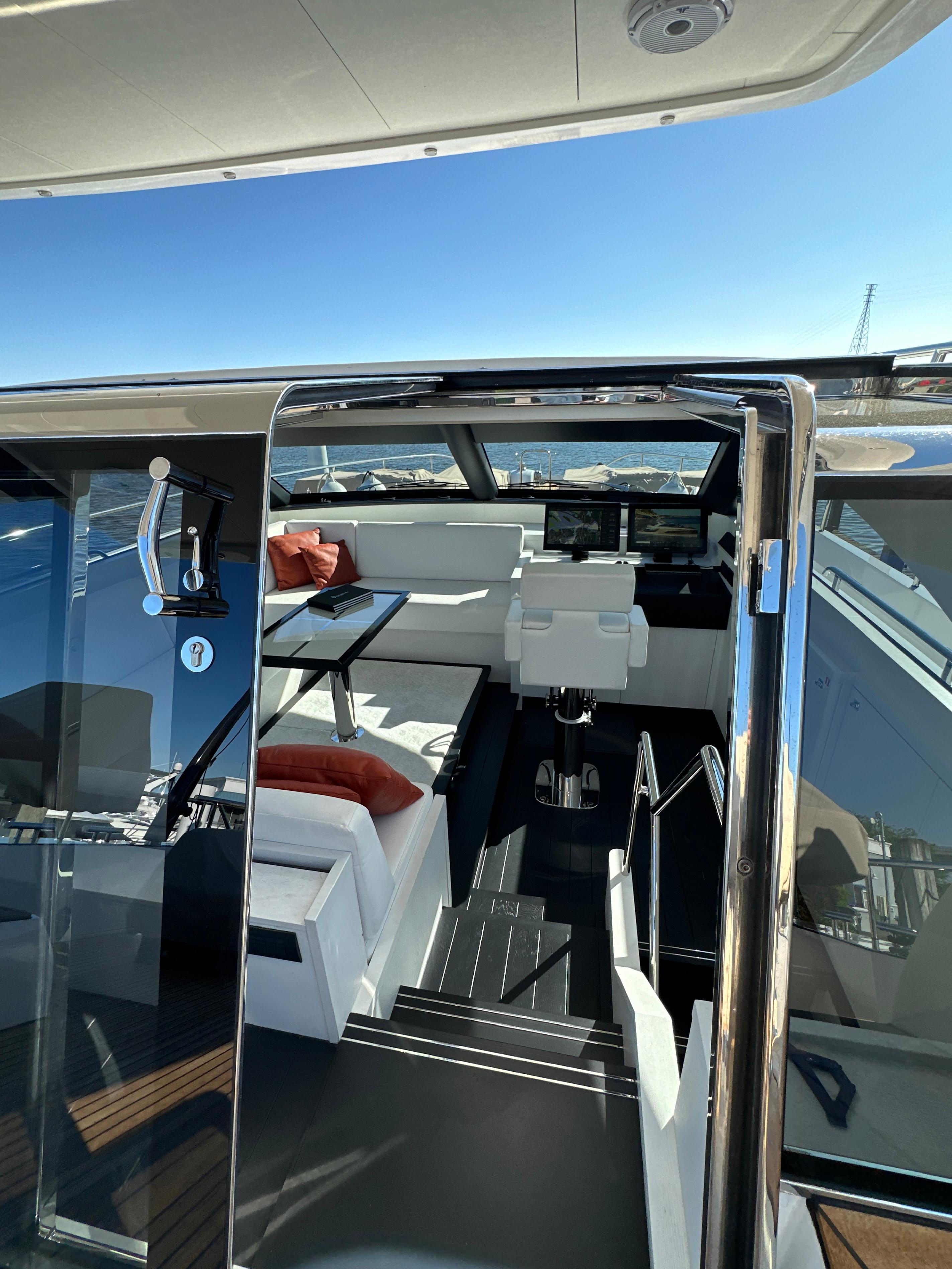 Interior view of 2019 Van der Valk BeachClub 600 yacht, featuring modern seating and navigation area.