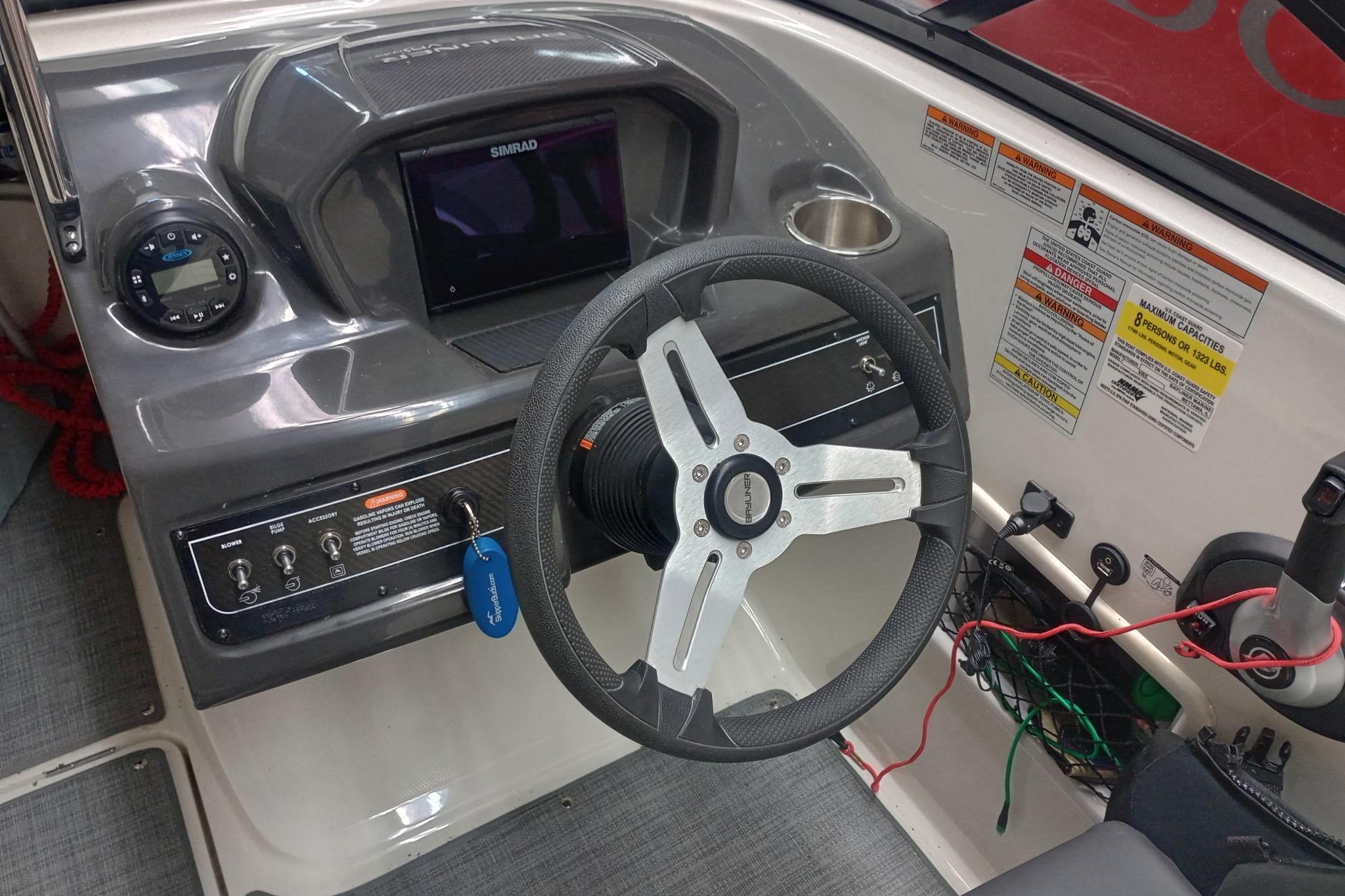 2022 Bayliner VR5 Bowrider I/O dashboard with steering wheel and control panel.