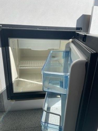 Open Spartan 2600 Olympia refrigerator, 2025 model, showing empty interior and door shelves.
