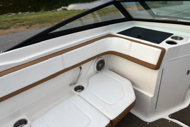 2017 Searay SPX210 boat interior with white and tan seating, cup holders, and speaker.