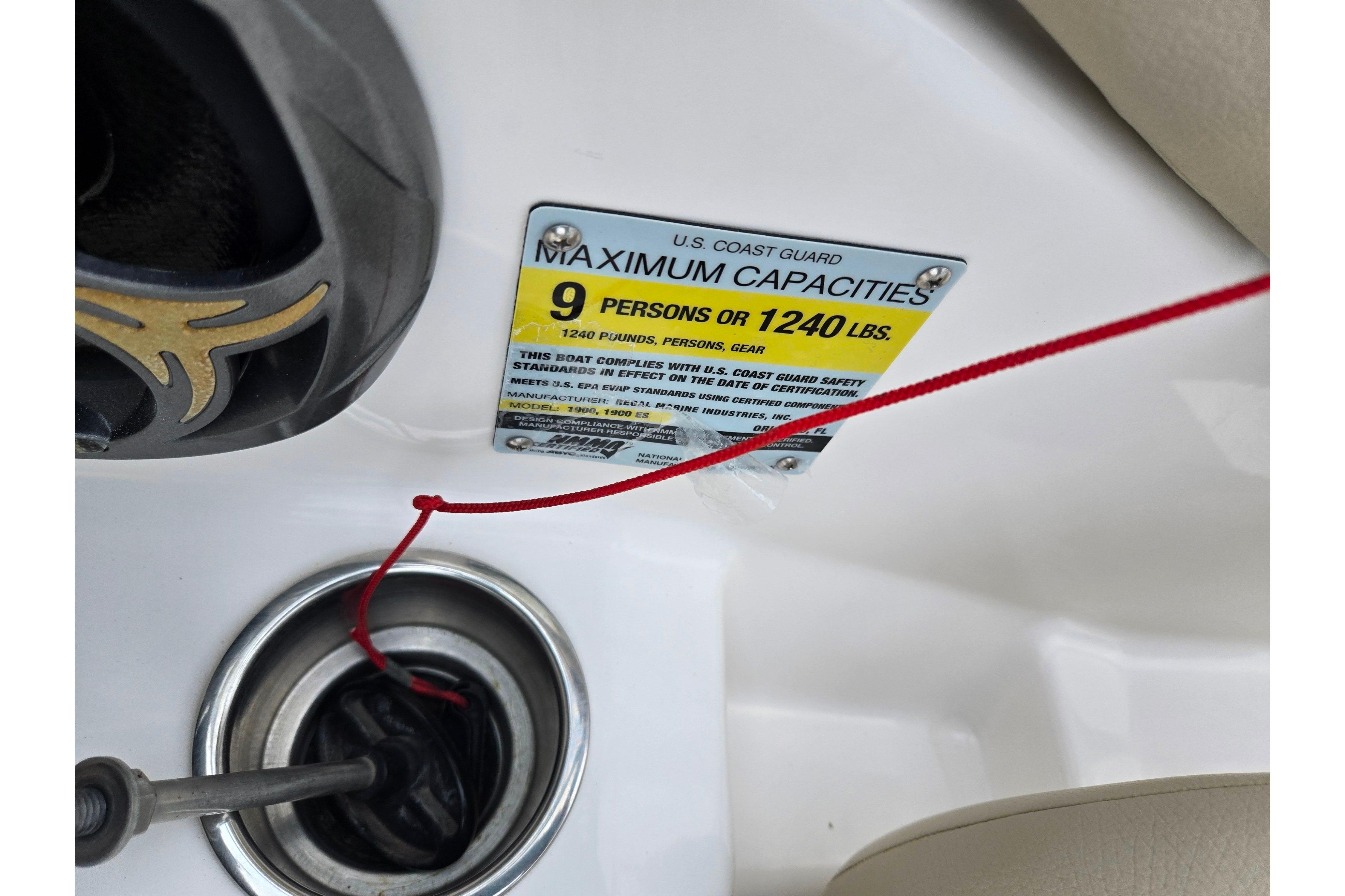2015 Regal 1900 ES Bowrider capacity label, 9 persons or 1240 lbs, U.S. Coast Guard compliant.