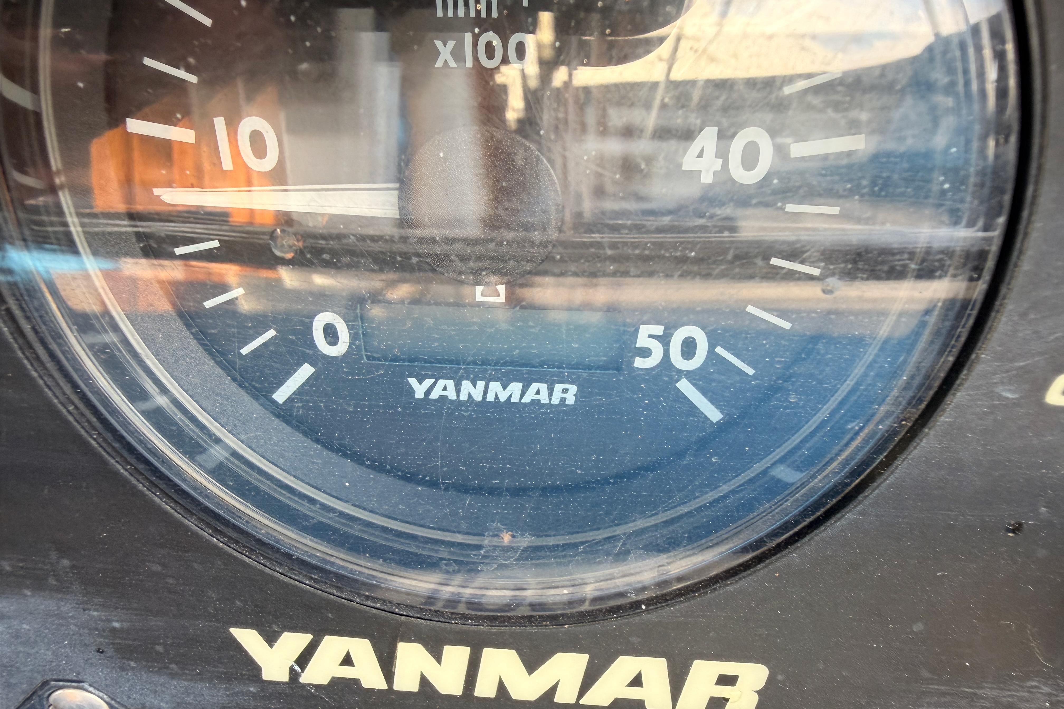 Close-up of a Yanmar tachometer on a 1991 Hylas 51 sailboat.