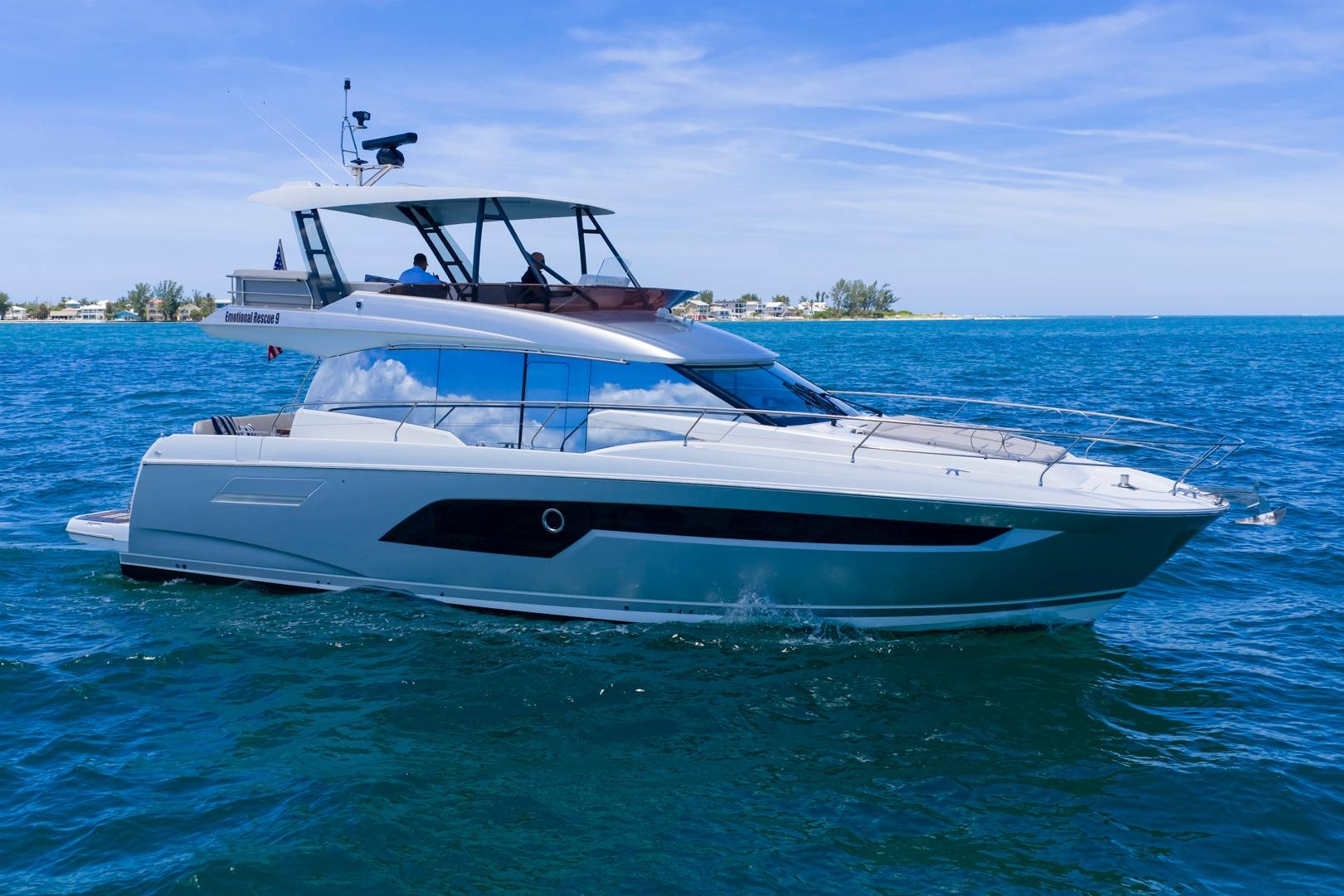 2022 Prestige 520 yacht cruising on blue ocean waters.