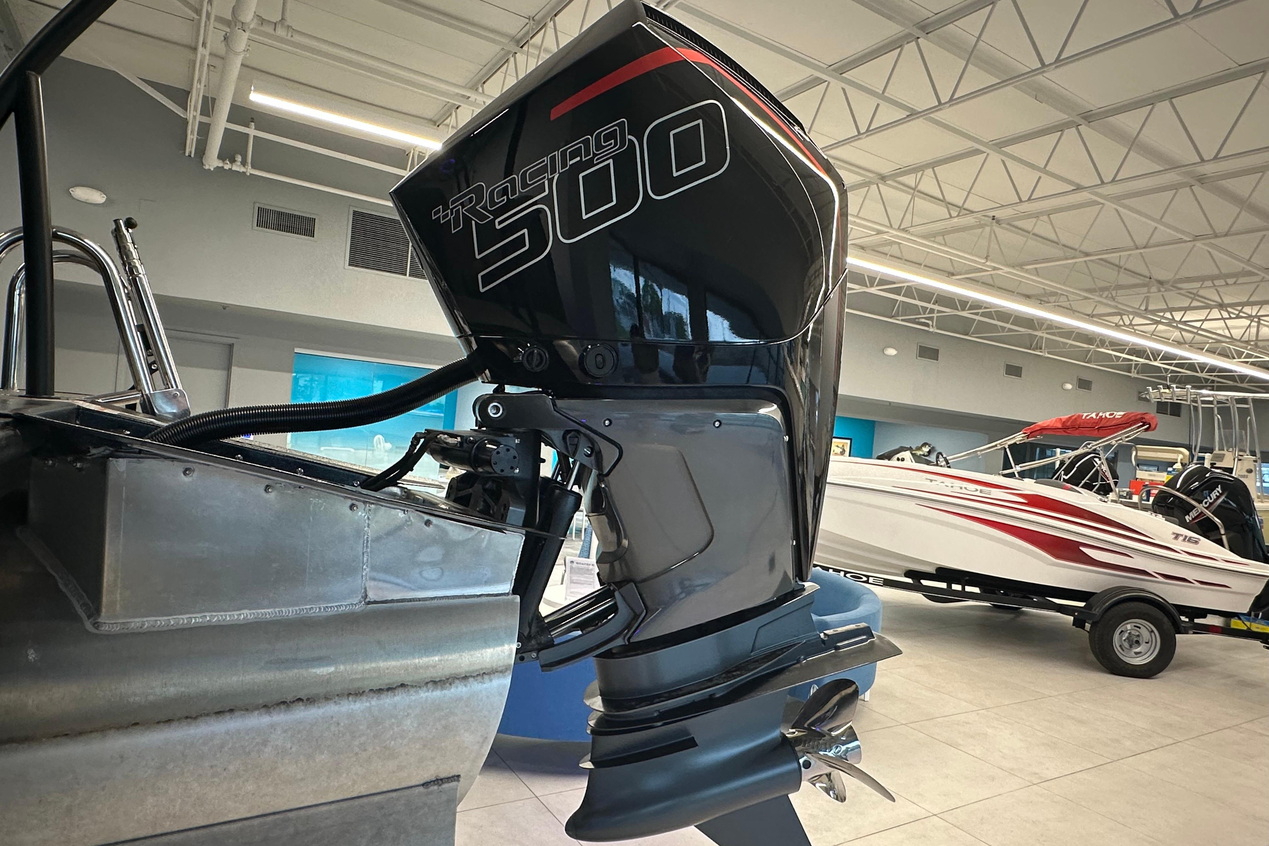 2025 Veranda VX 27 DCRC with powerful Racing 500 outboard motor in showroom.