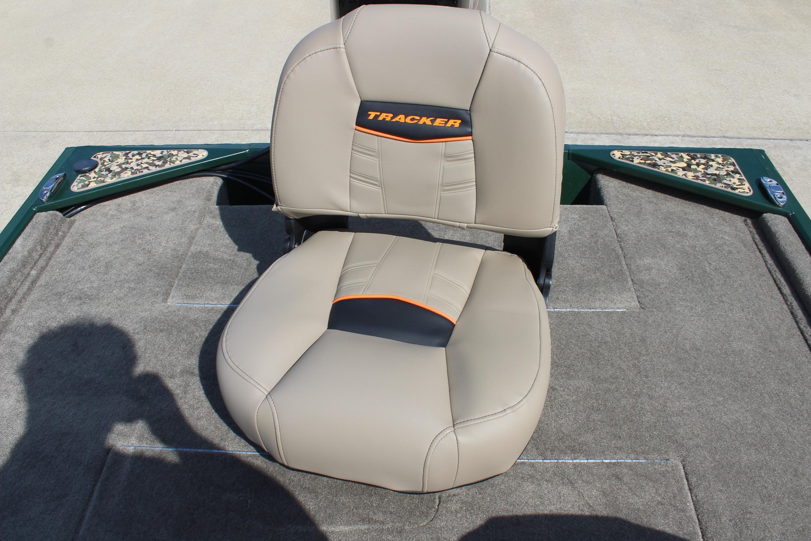 2026 Tracker Bass Tracker Classic Limited boat seat, beige with orange accents, on carpeted deck.