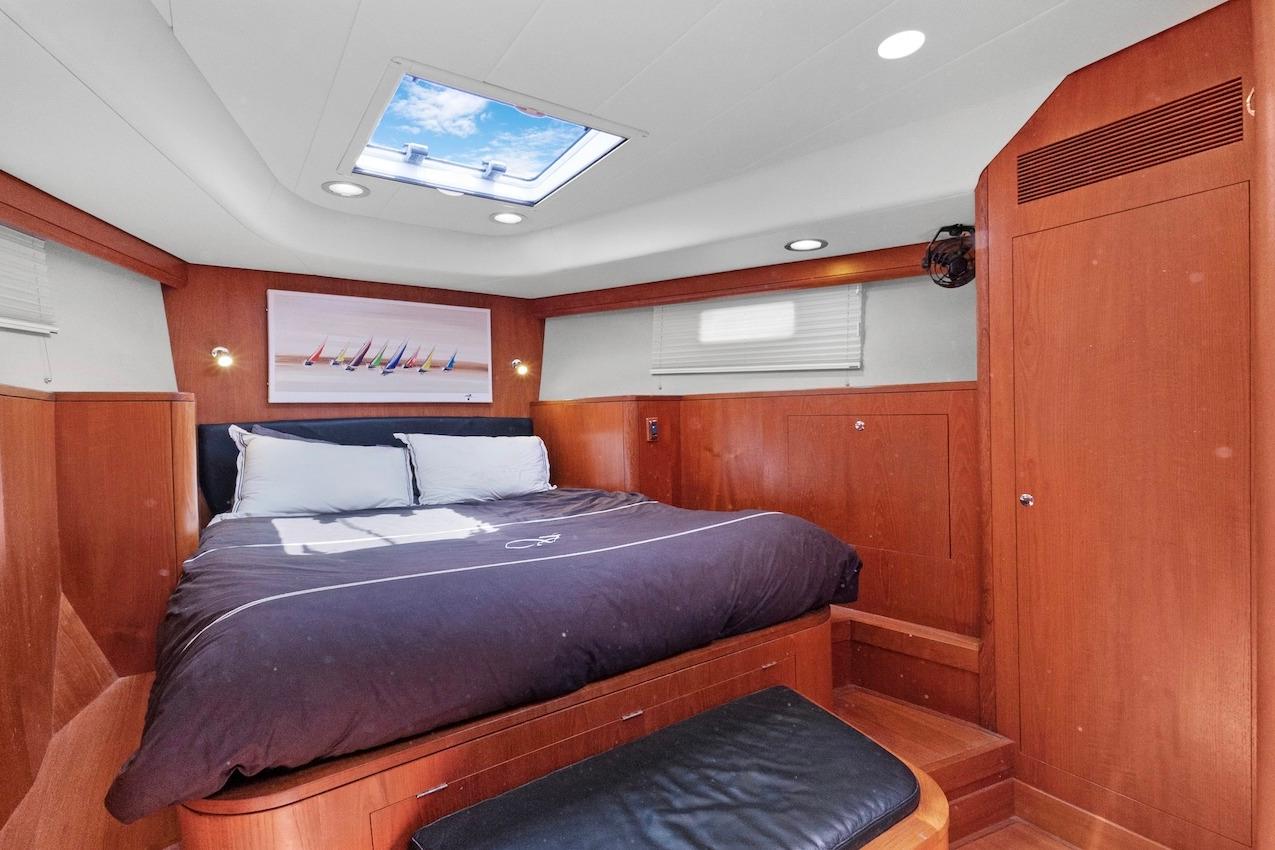Luxurious cabin interior of 2011 Southerly 57 RS yacht with skylight and wooden finishes.