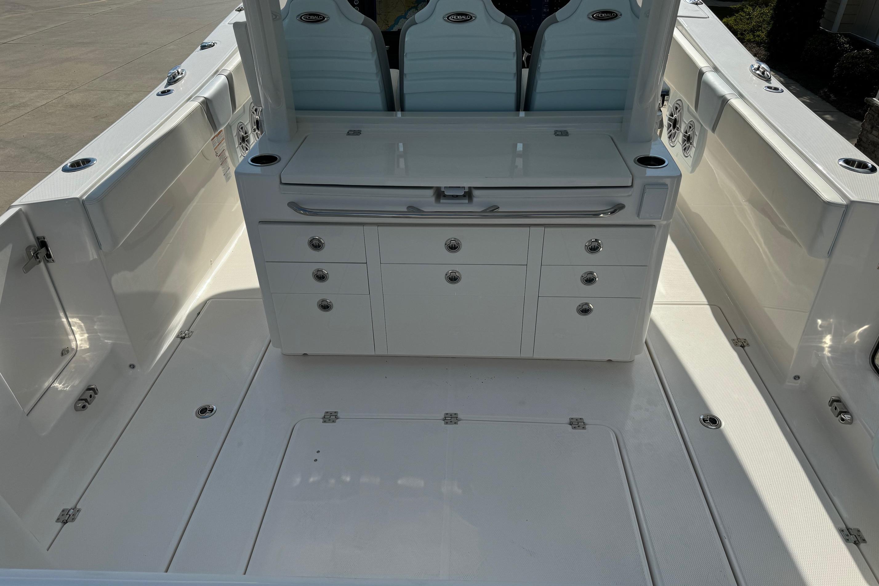 2025 Robalo R360 Center Console boat interior with seating and storage compartments.