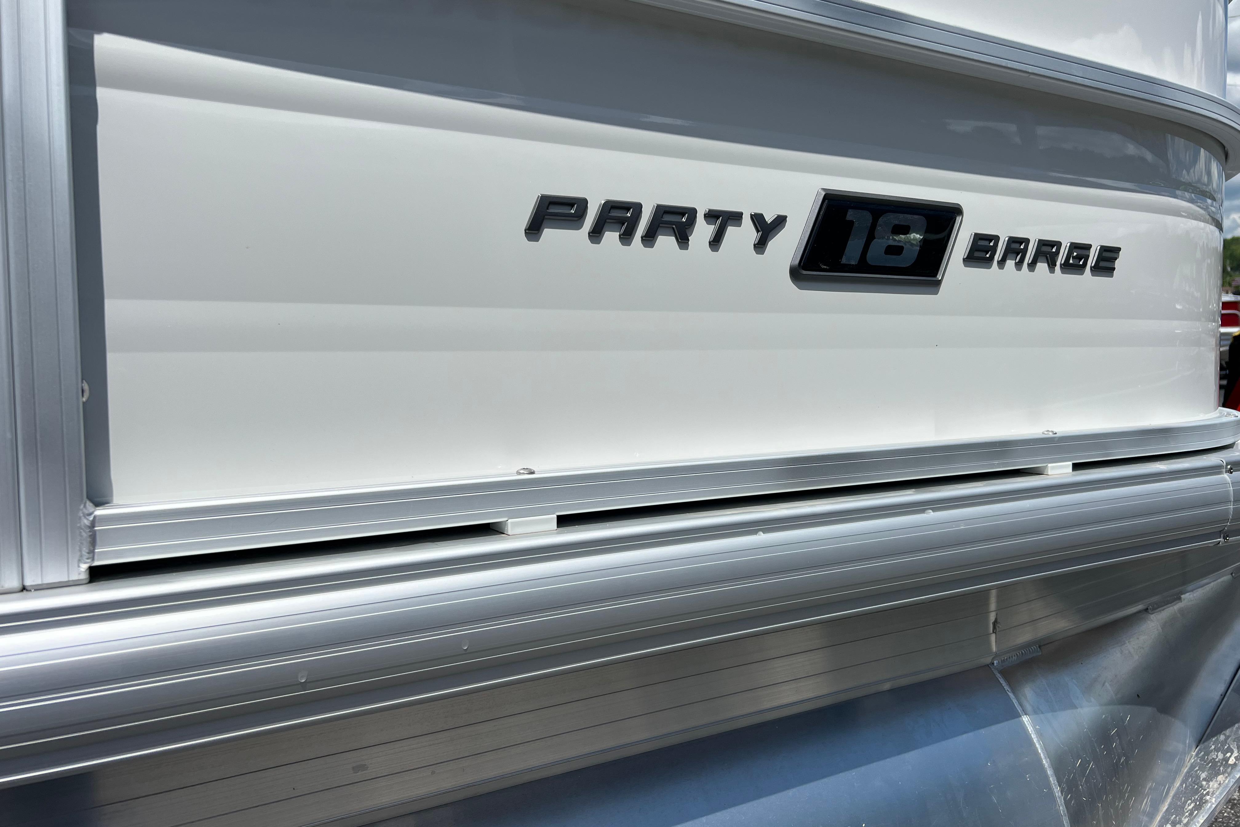 2026 Sun Tracker Party Barge 18 DLX pontoon boat side view.