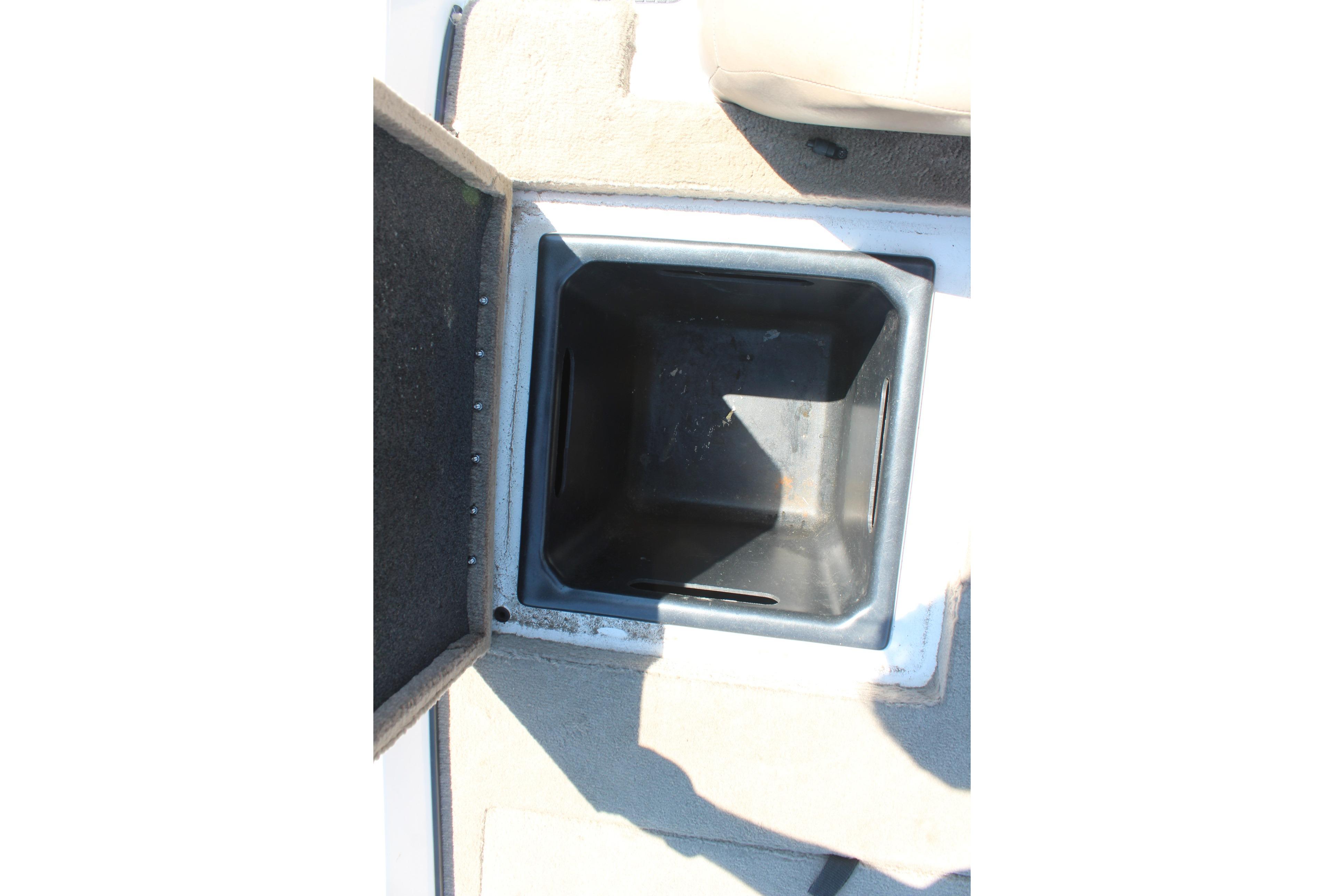 Open storage compartment on a 2003 Nitro NX 750 SC boat.