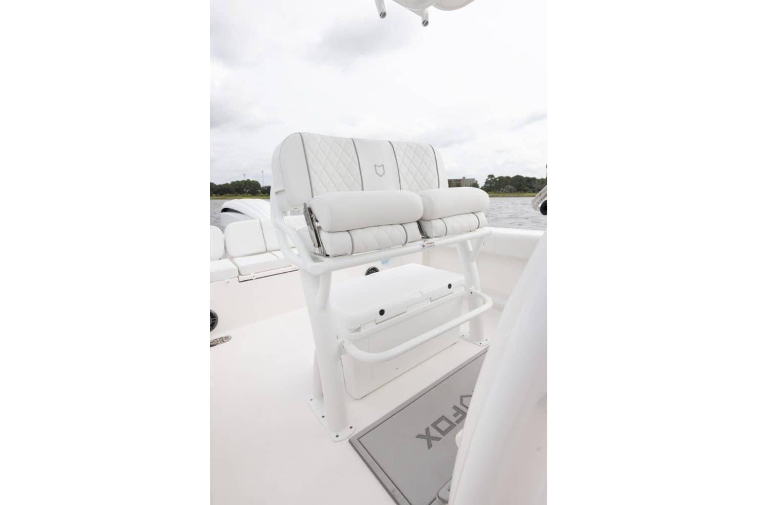 2027 Sea Fox 248 Commander boat interior with white cushioned seating and sleek design.