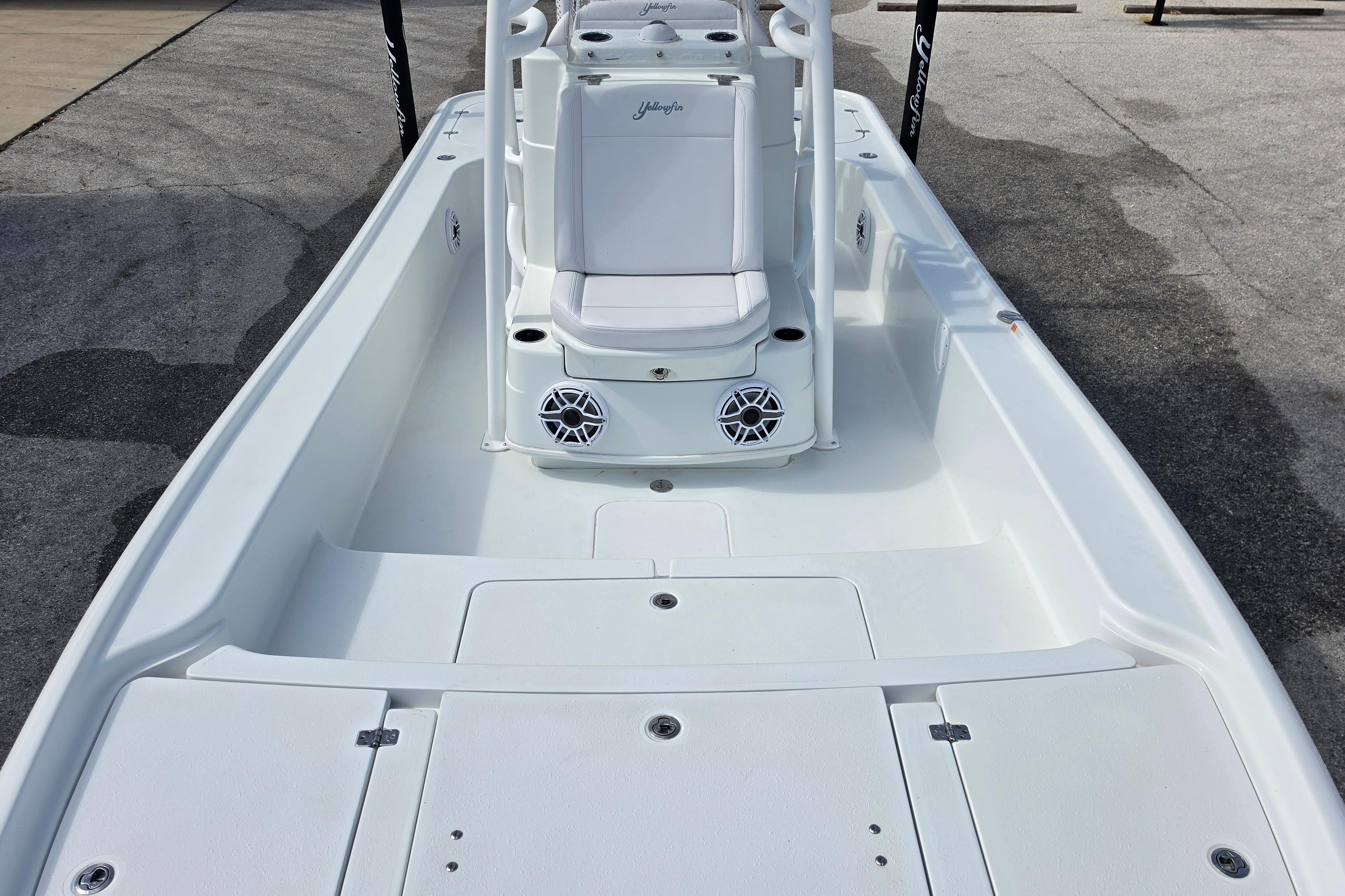 2026 Yellowfin 24 Bay CE boat interior with seating and storage compartments.