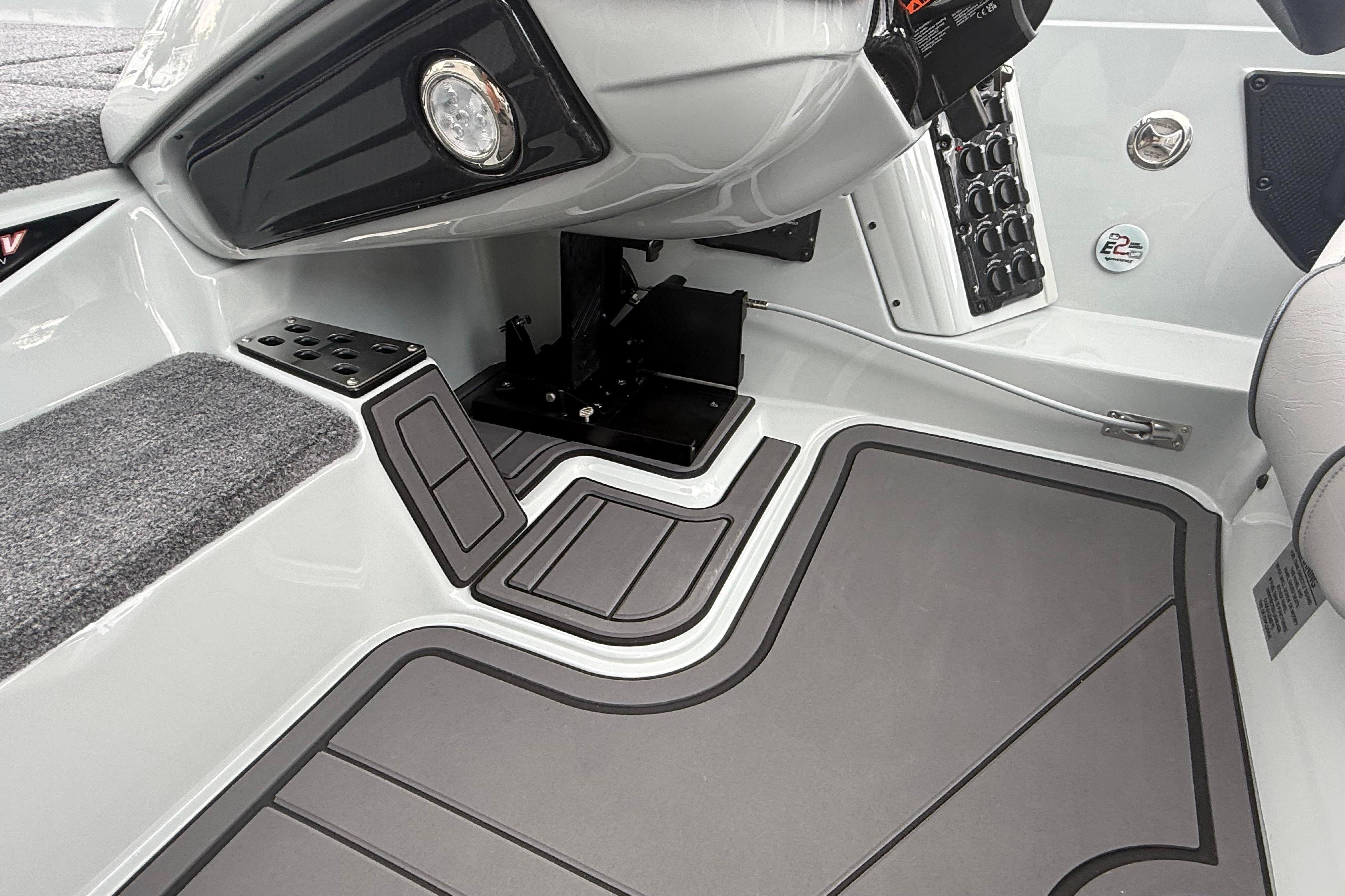 Interior of 2027 Phoenix 921 Elite X II boat, featuring sleek controls and modern design.