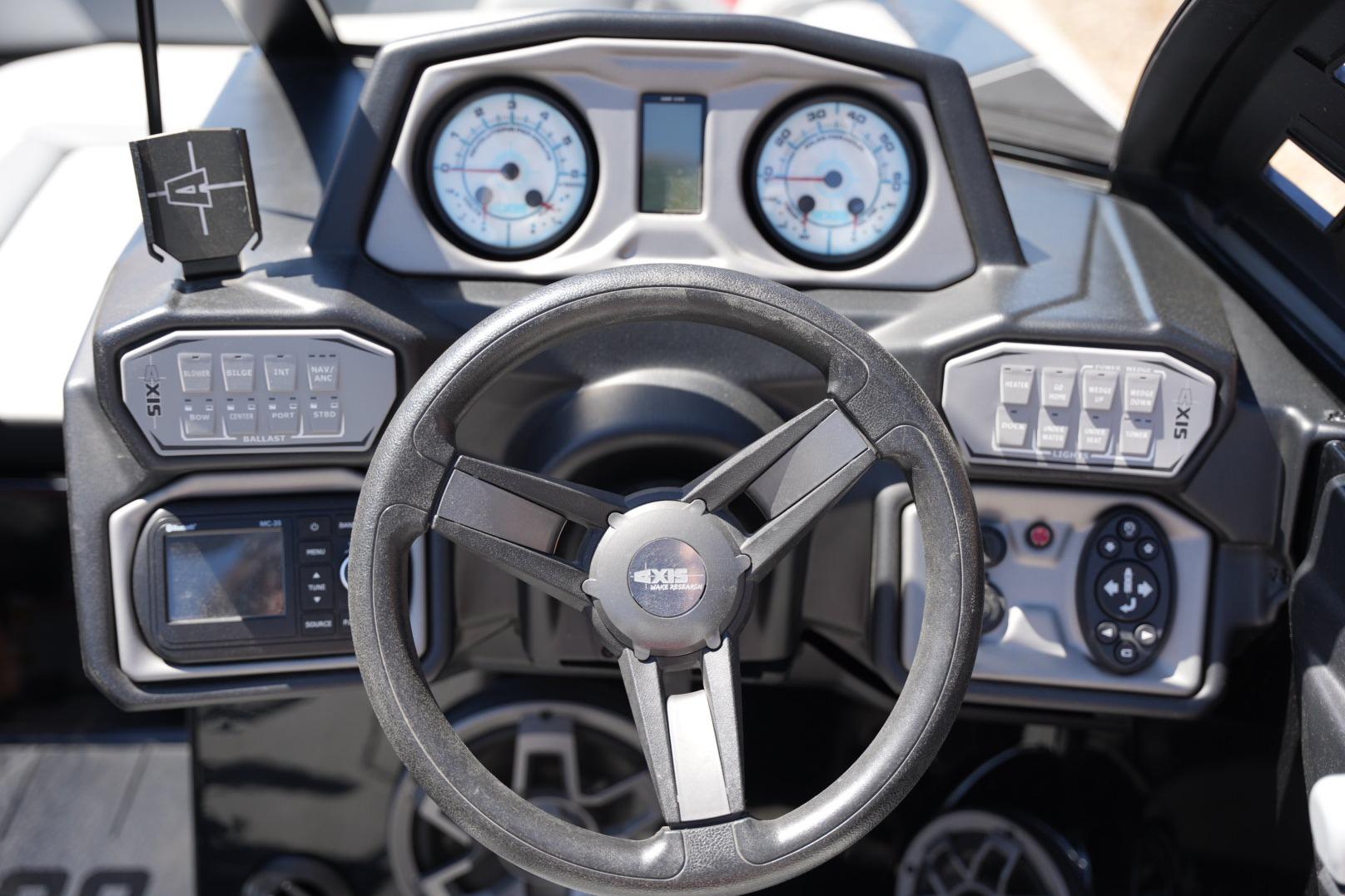2019 Axis A22 boat dashboard with steering wheel, gauges, and control panels.