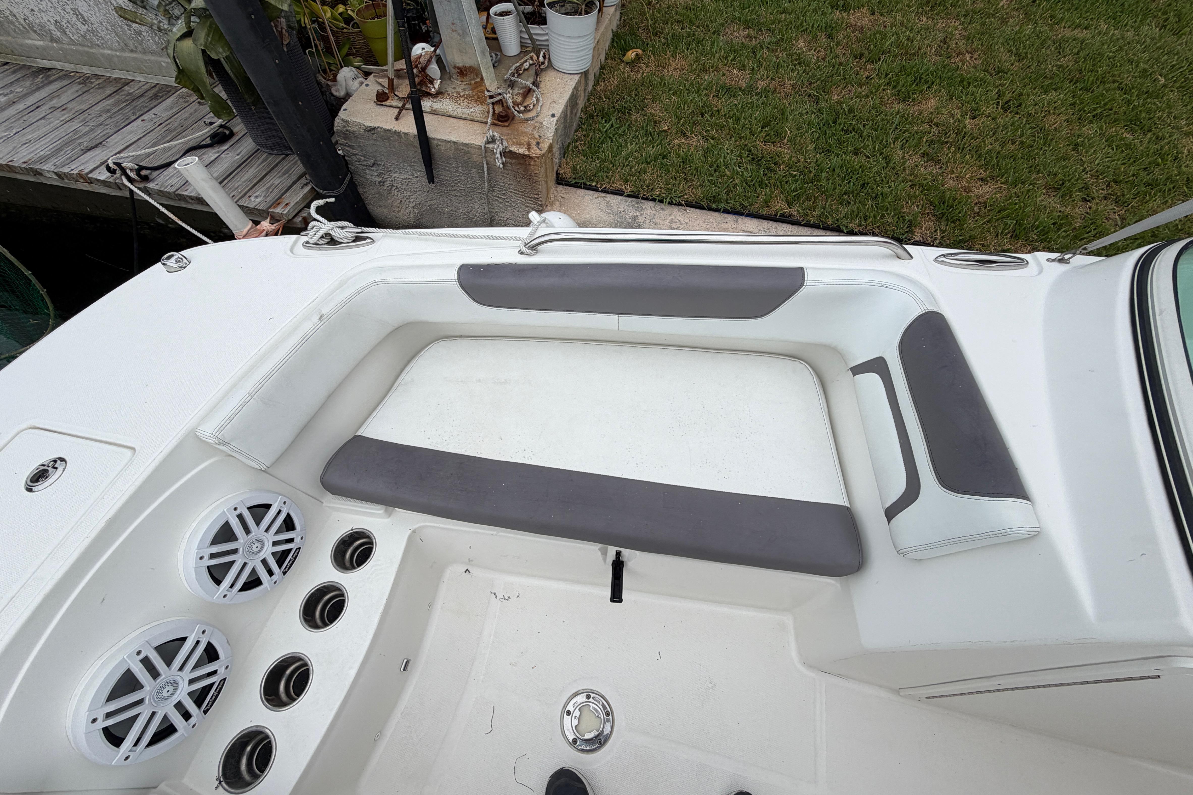 2019 World Cat 230 DC boat interior with seating and audio system.