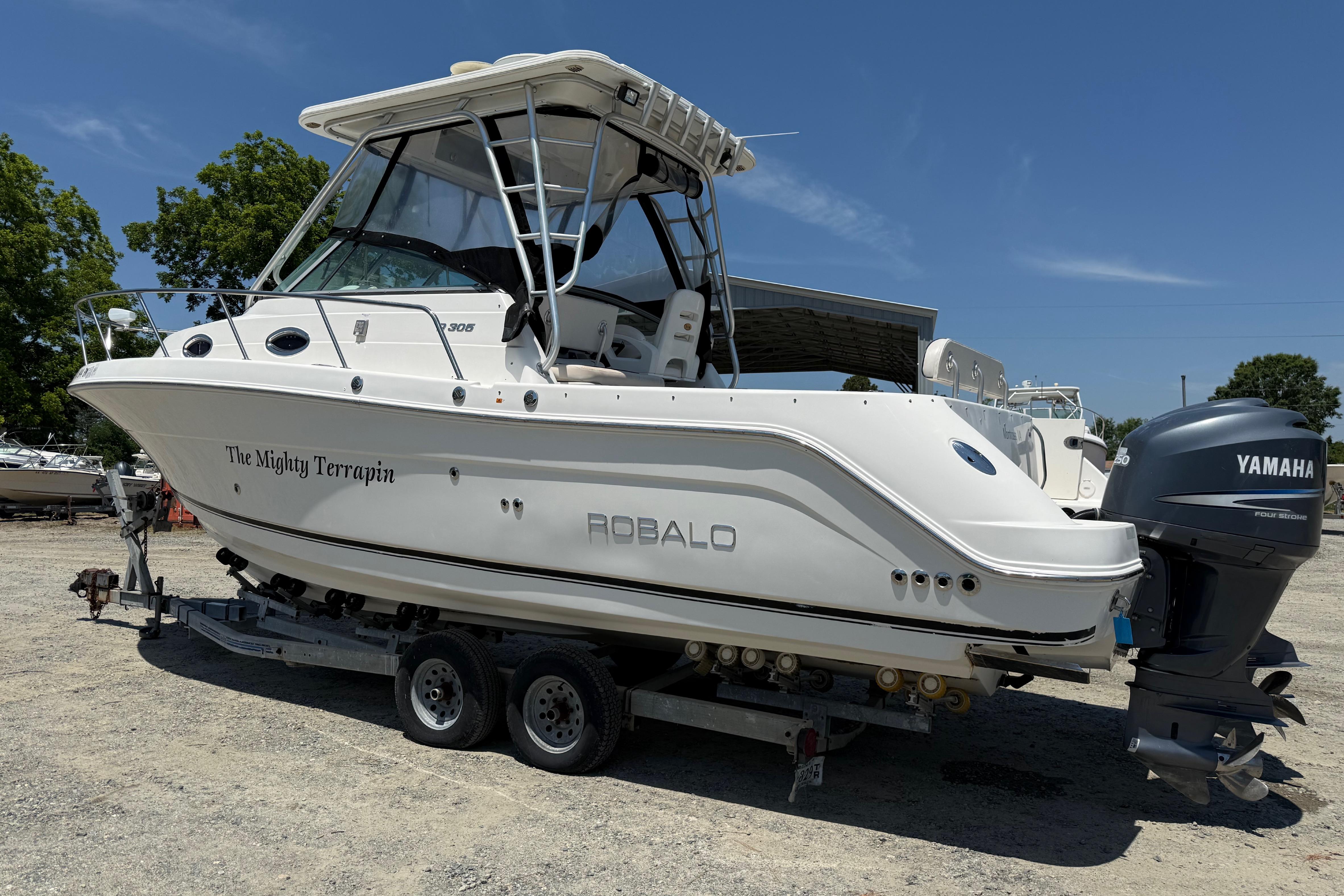 2007 Robalo R305 Walkaround boat on trailer with Yamaha outboard motor.