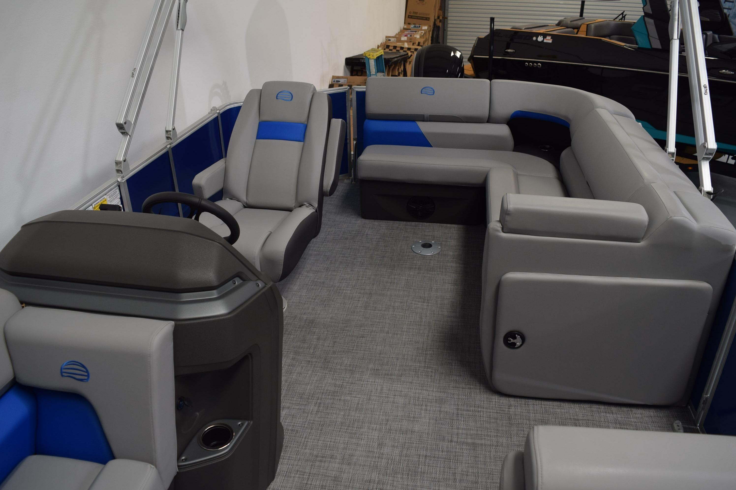 Interior of 2026 Sun Tracker Party Barge 20 DLX with gray and blue seating.
