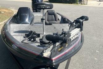 2014 Skeeter ZX200 fishing boat with trolling motor on a sunny day.