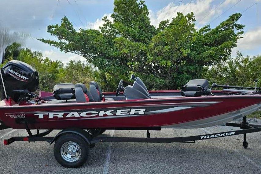 2025 Tracker Pro Team 175 boat on trailer, parked outdoors.