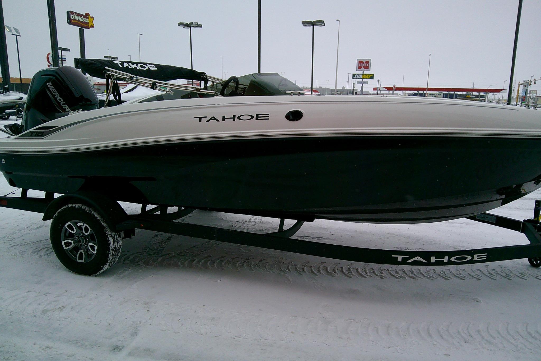 2026 Tahoe T18 boat on trailer in snowy parking lot.