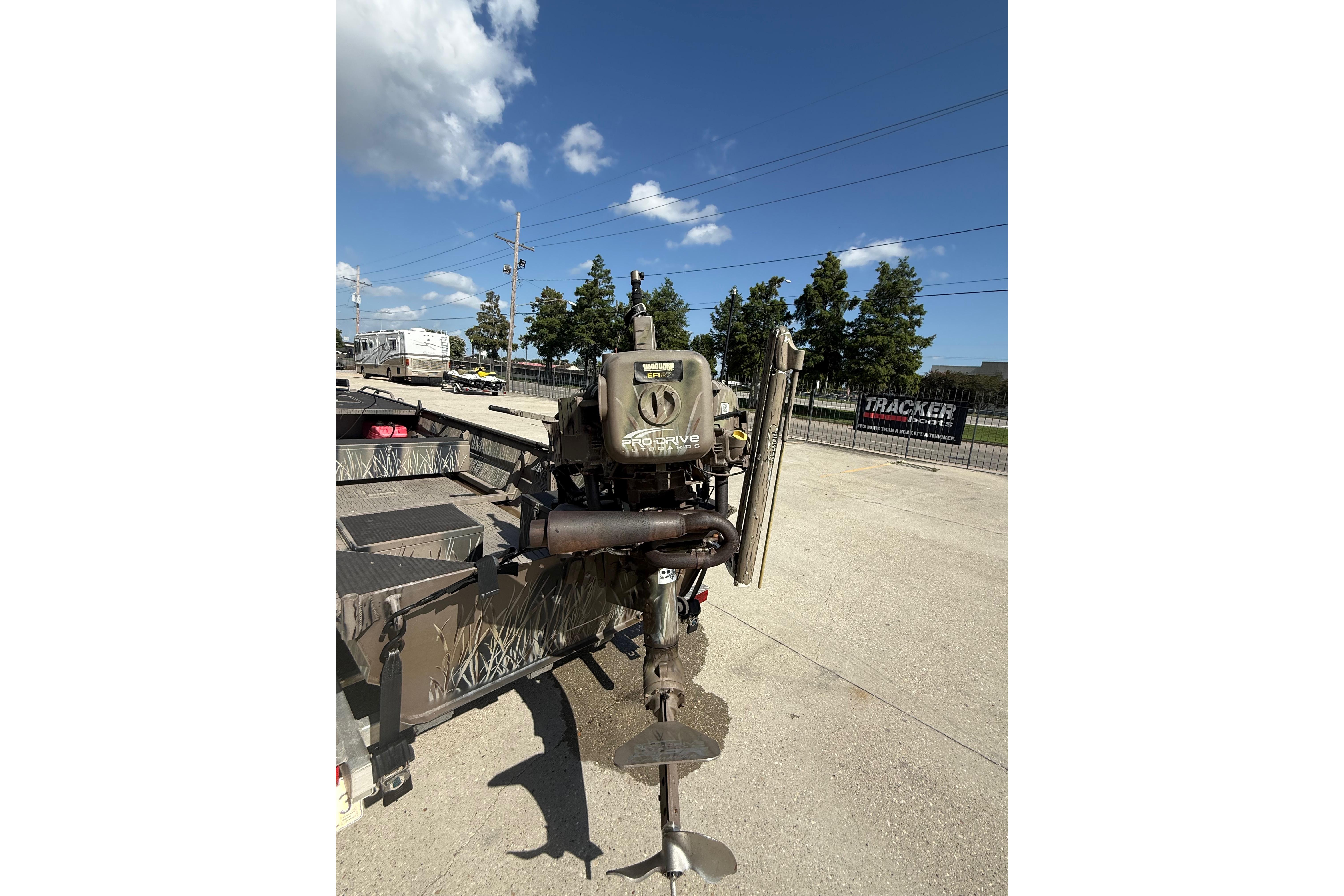 Pro-Drive 2048 boat motor, 2017 model, on a trailer under a clear blue sky.