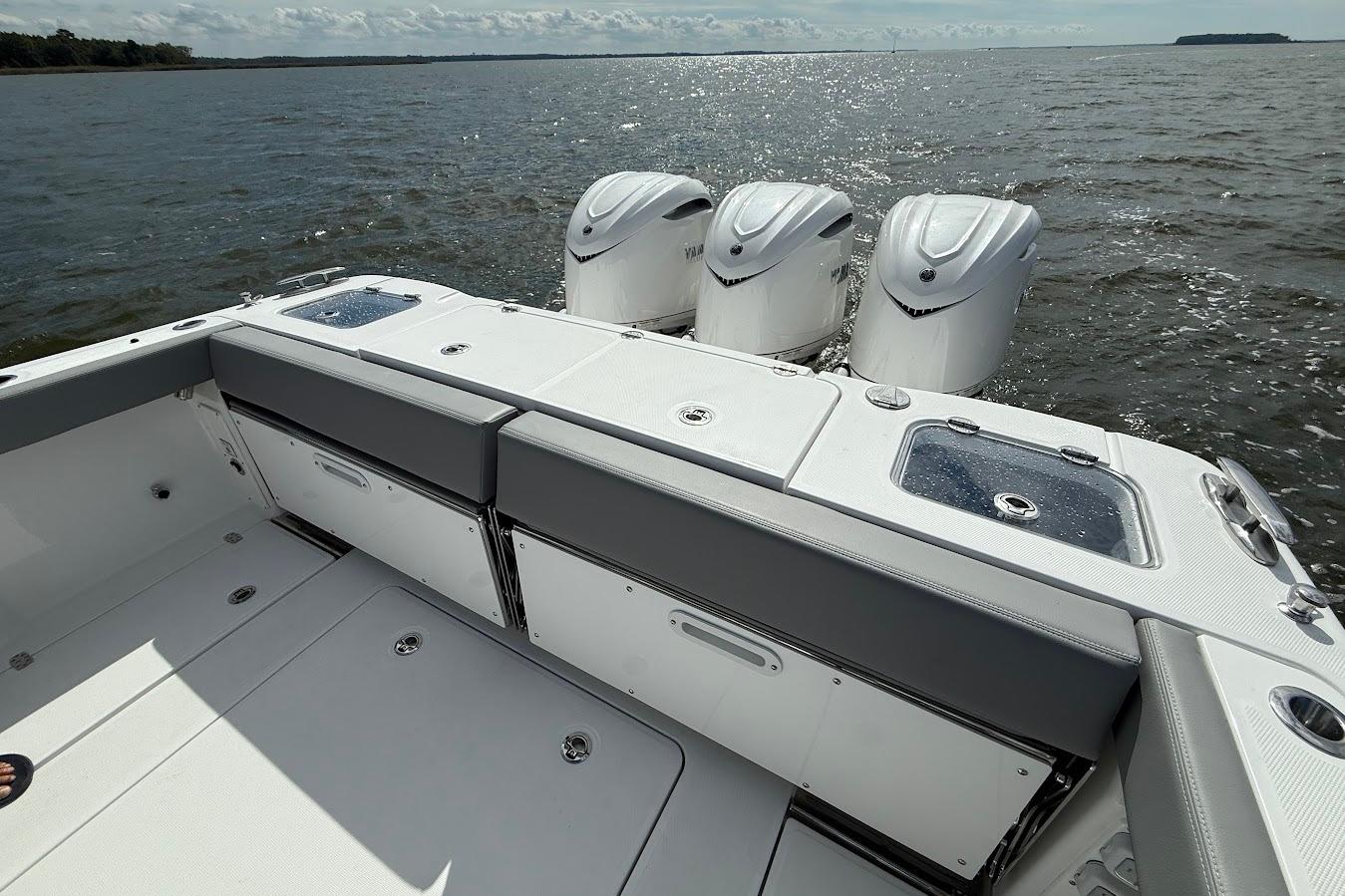 2026 Everglades 375 Center Console boat with triple engines on open water.