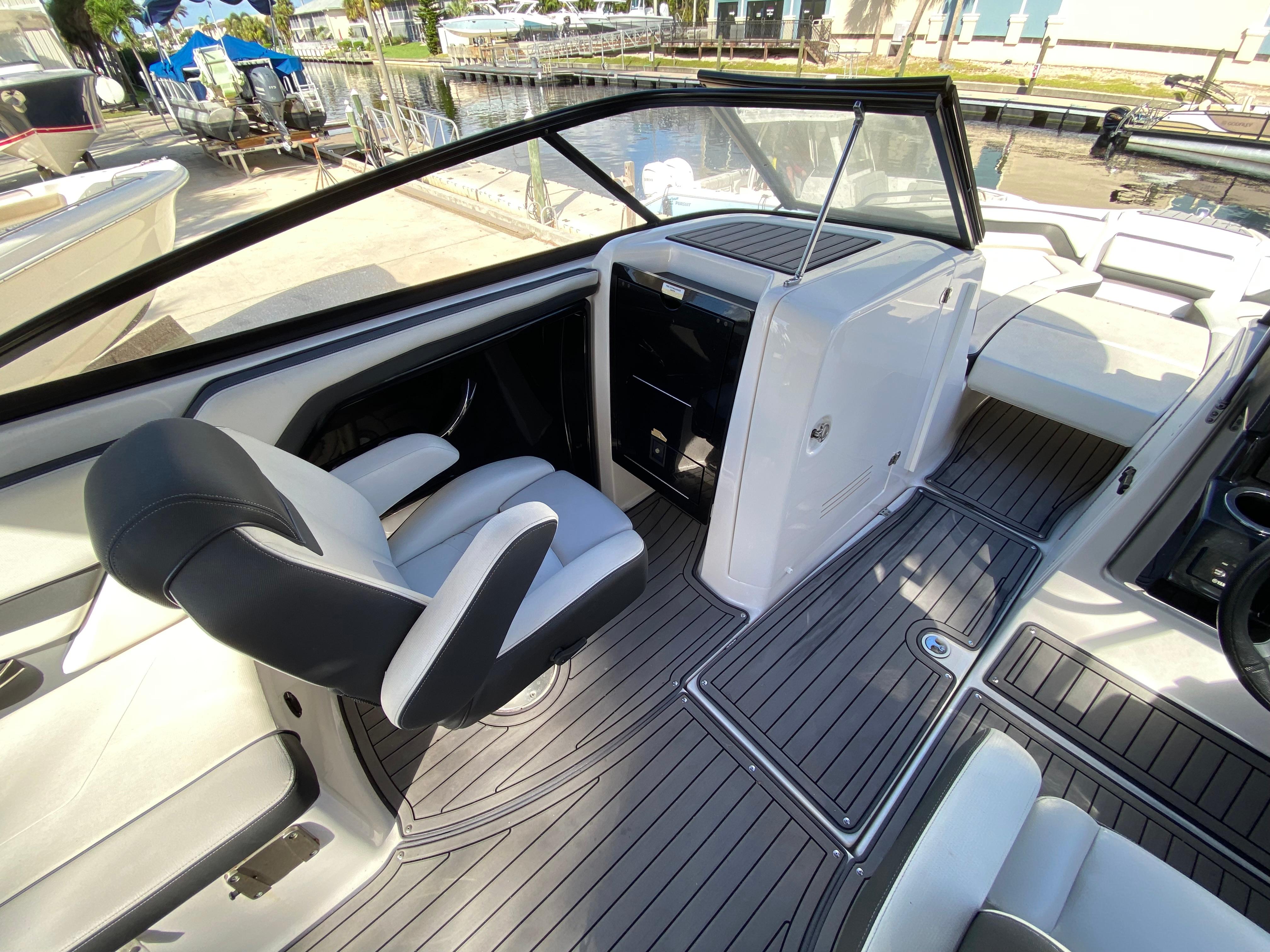 2018 Yamaha Boats 242 Limited S interior with sleek seating and modern dashboard.
