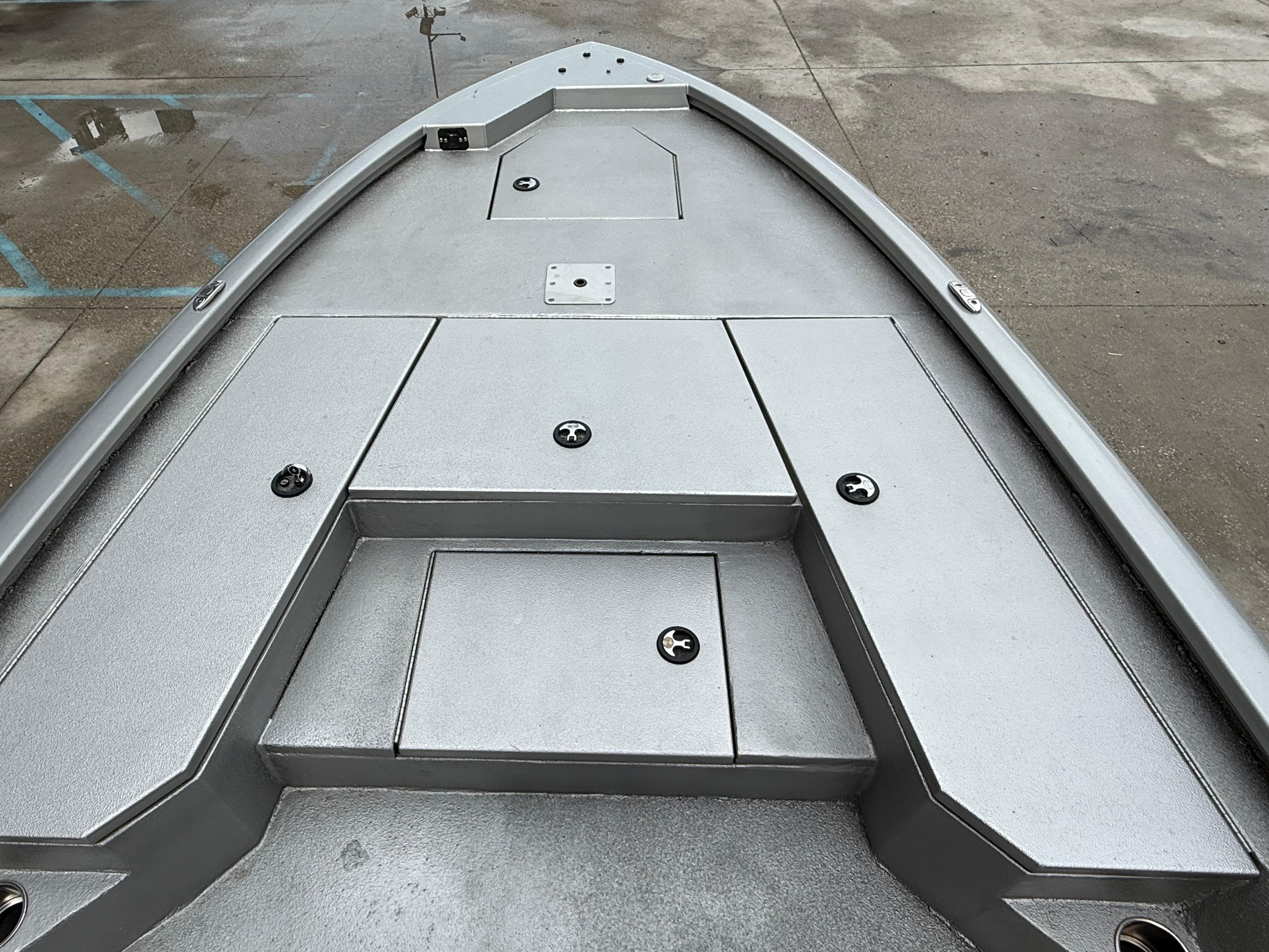 Bow deck of 2020 Avid 23 FS Platinum boat, featuring storage compartments.