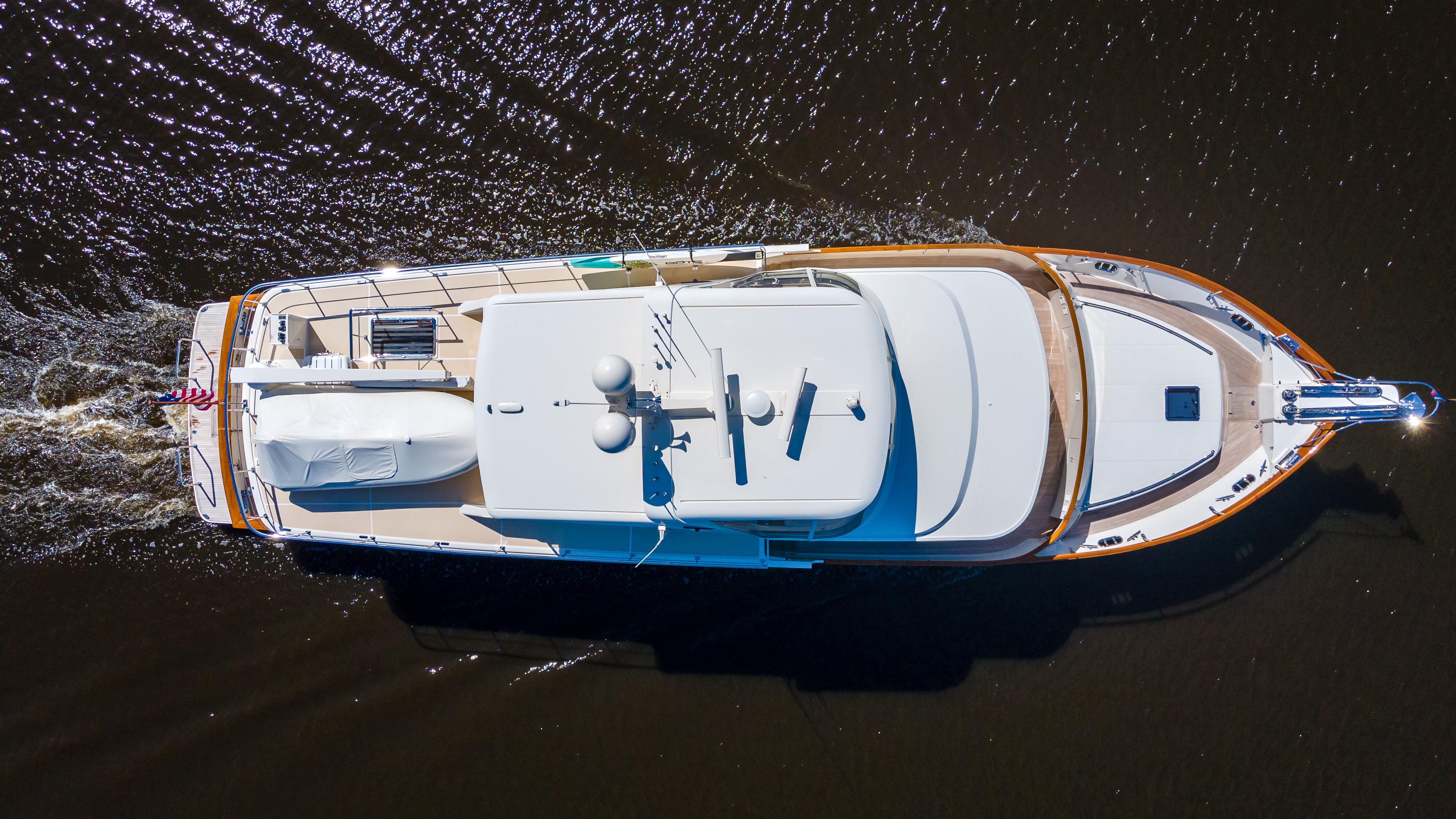 Aerial view of 2027 Fleming 78 yacht cruising on water.