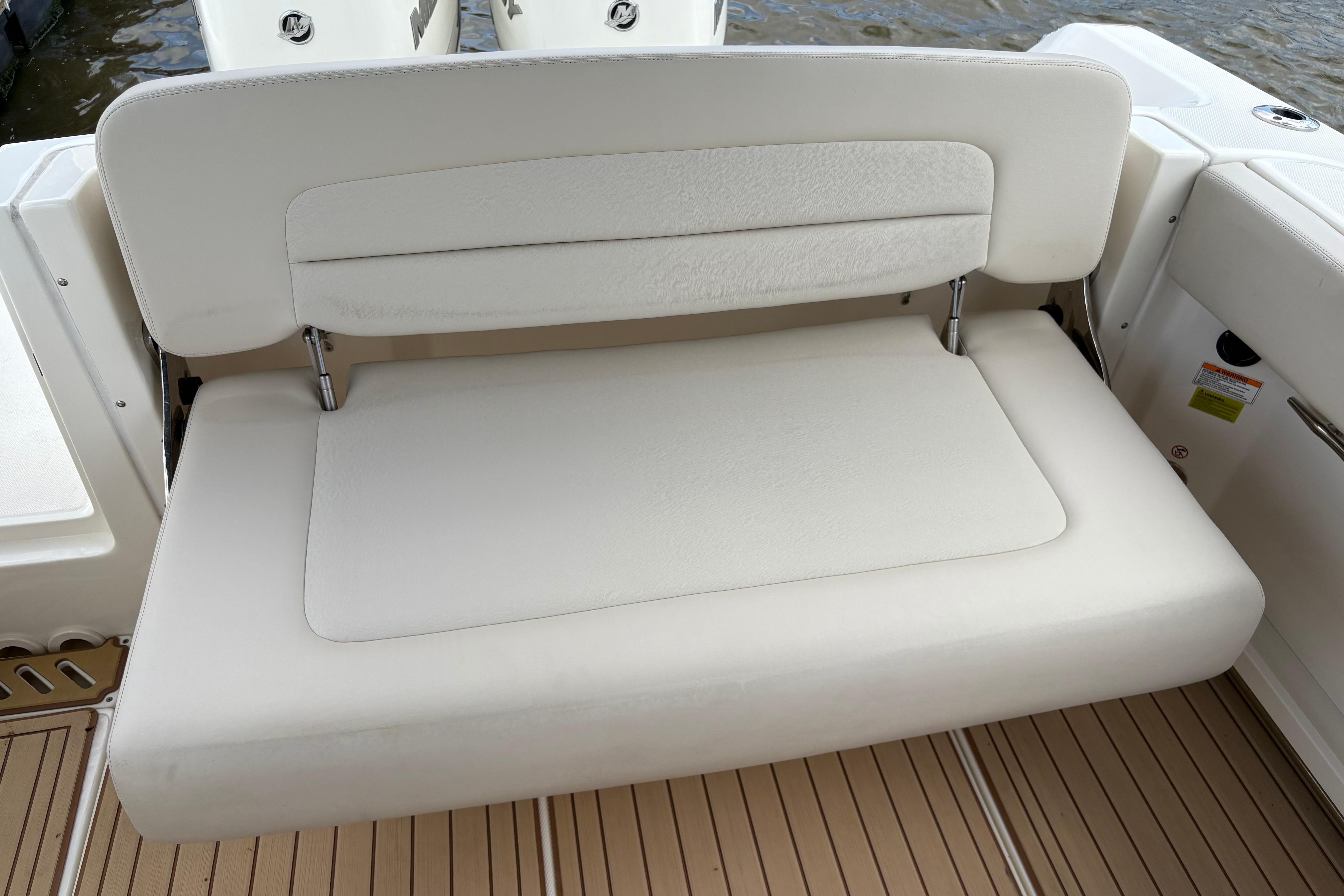 2017 Boston Whaler 270 Vantage boat with white cushioned seating on deck.