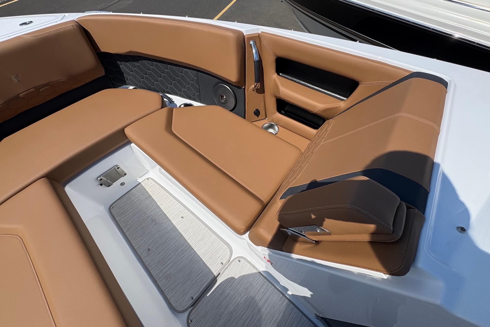 Luxurious seating area on 2026 Four Winns H6 boat with tan upholstery.