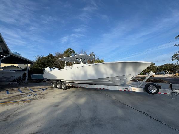 2025 Yellowfin 39 Offshore boat on trailer under clear blue sky.