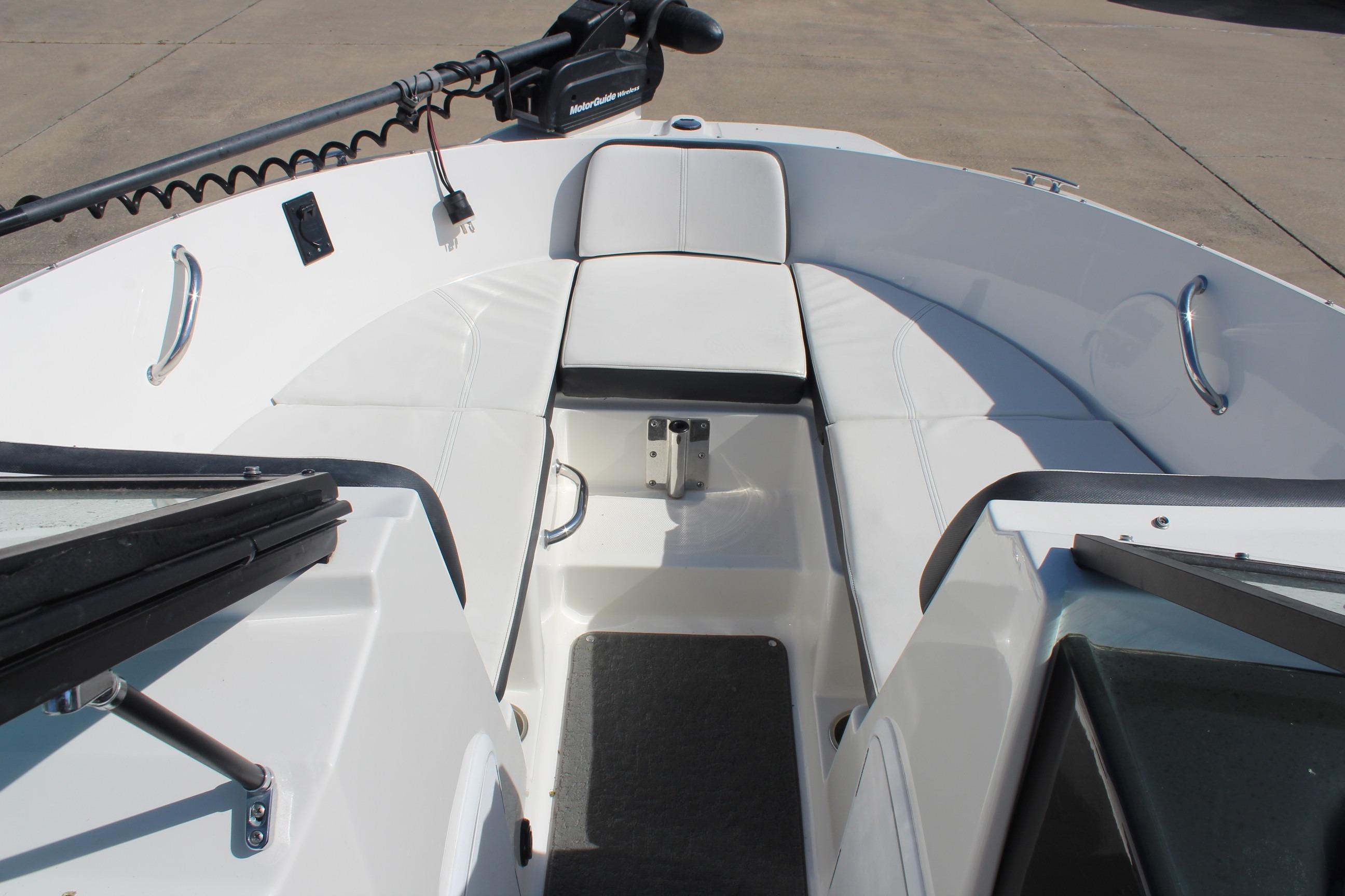 2015 Sea Ray 19 SPX OB boat interior with white seating and trolling motor.