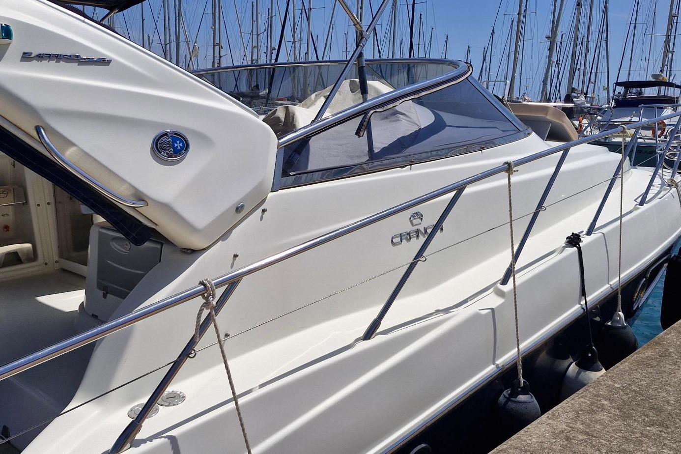2009 Cranchi Zaffiro 36 yacht docked in a marina, showcasing sleek design and luxury features.