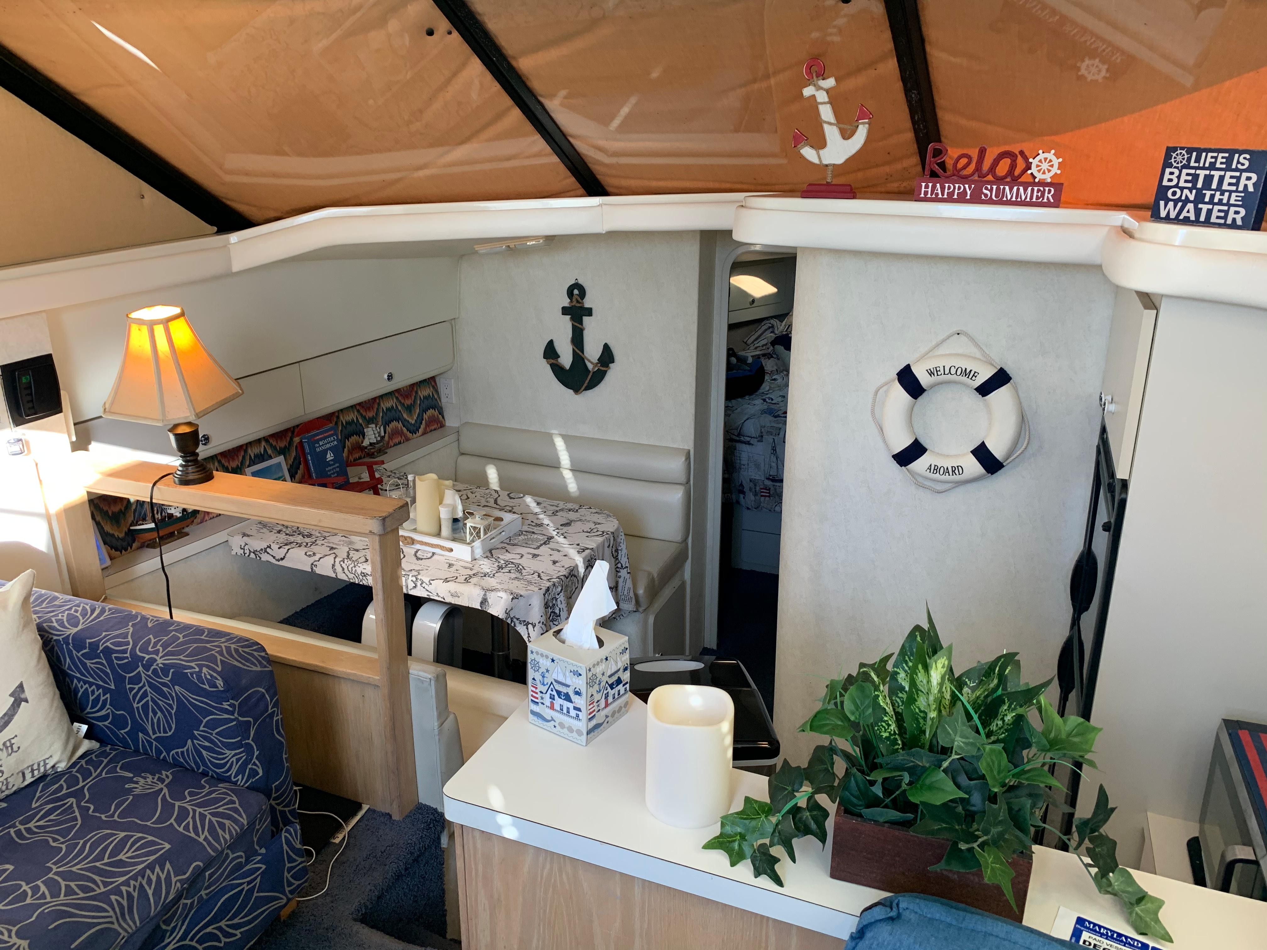 Interior of 1992 Silverton 34 Aft Cabin Motor Yacht with nautical decor and cozy seating.