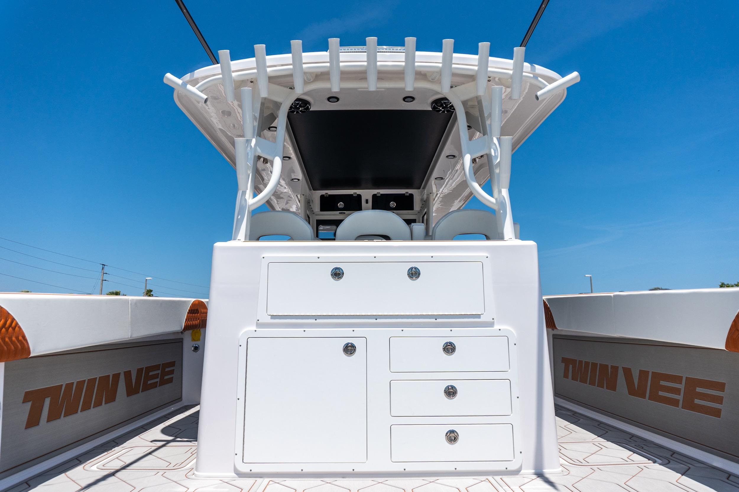 2026 Twin Vee 400 GFX2 CC boat interior with storage compartments and seating.