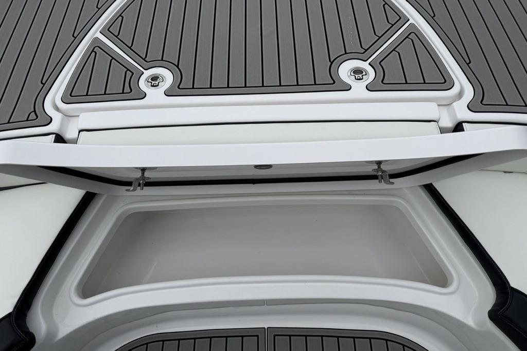2026 Tidewater 2500 Carolina Bay boat storage compartment with open hatch and sleek design.