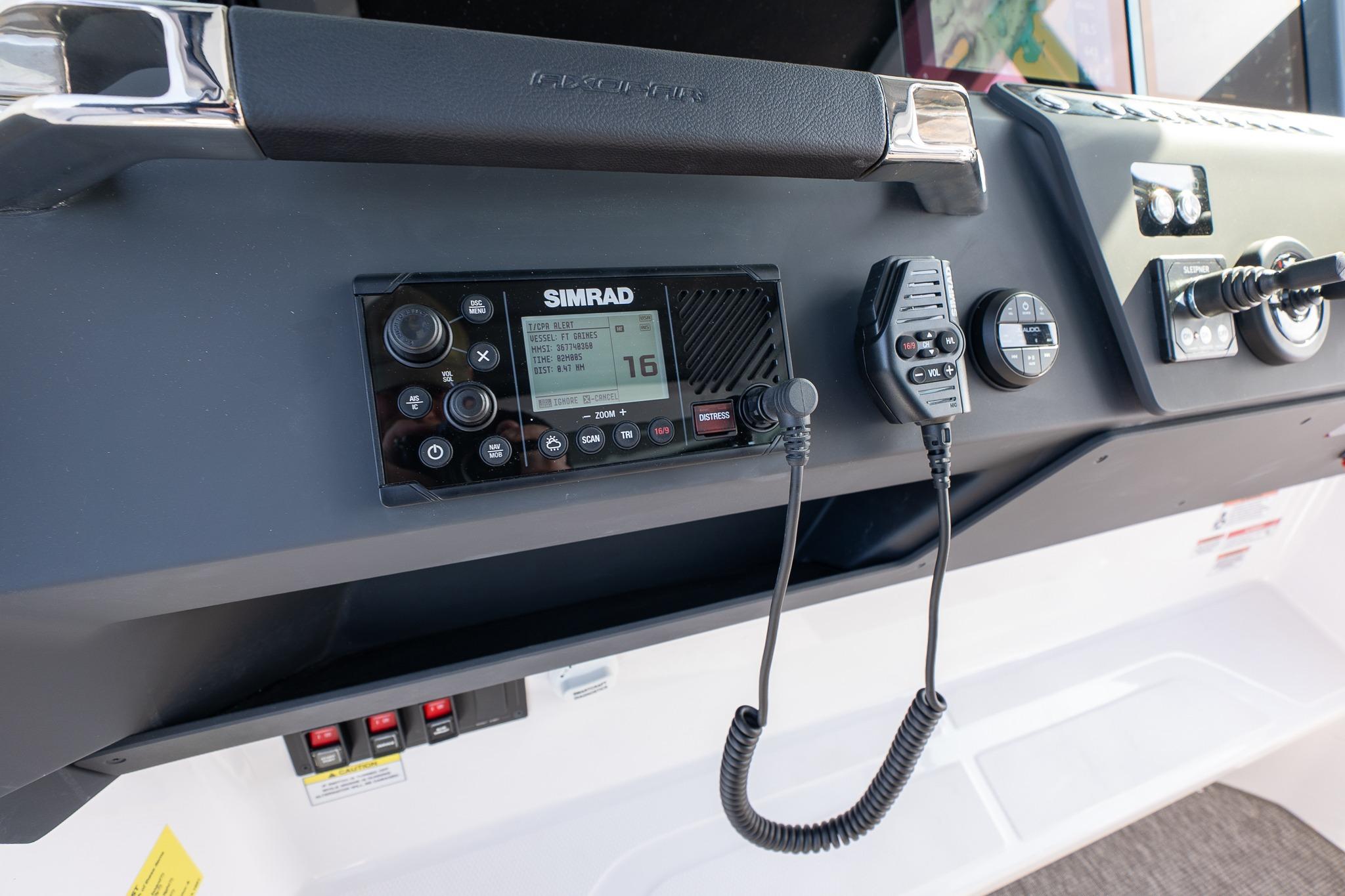 Control panel of 2026 Axopar 29 Cross Cabin with Simrad marine radio.