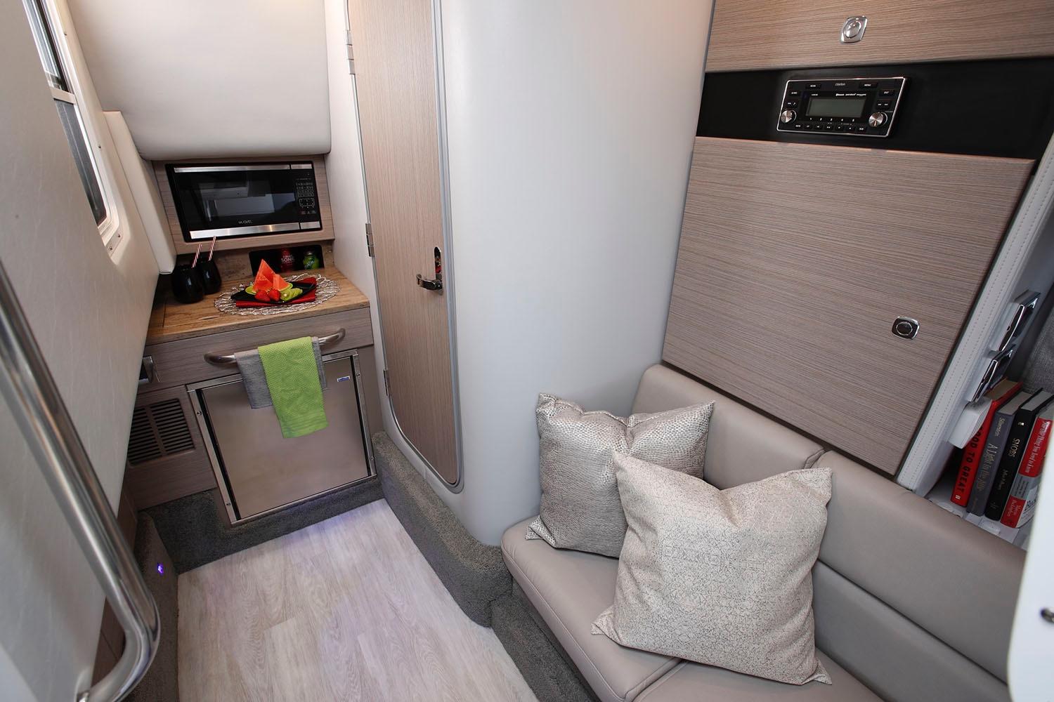 Manufacturer Provided Image: Interior of 2021 Formula 350 Crossover Bowrider I/O with kitchenette and seating area.