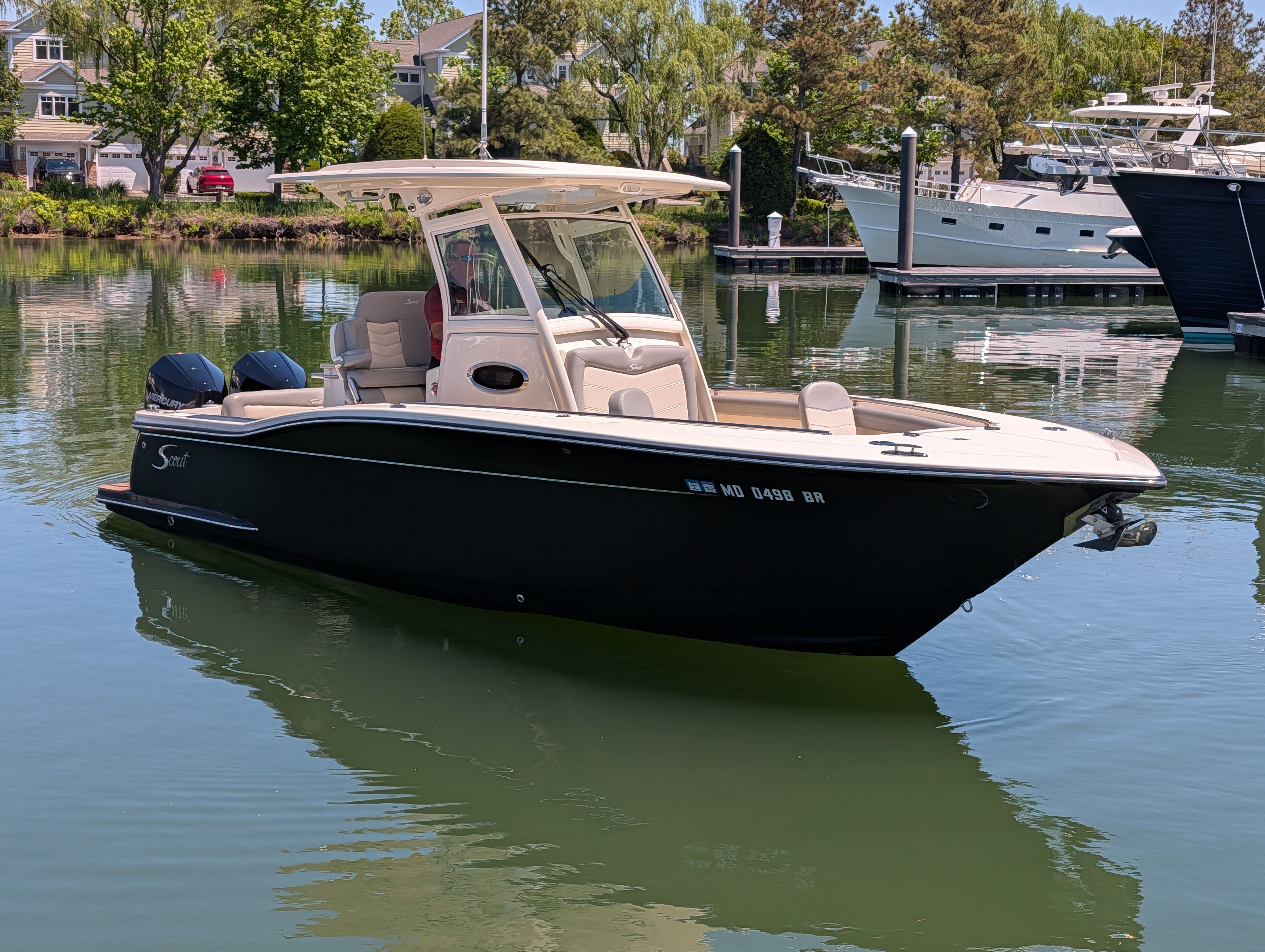 2020 Scout 255 LXF boat on calm water.