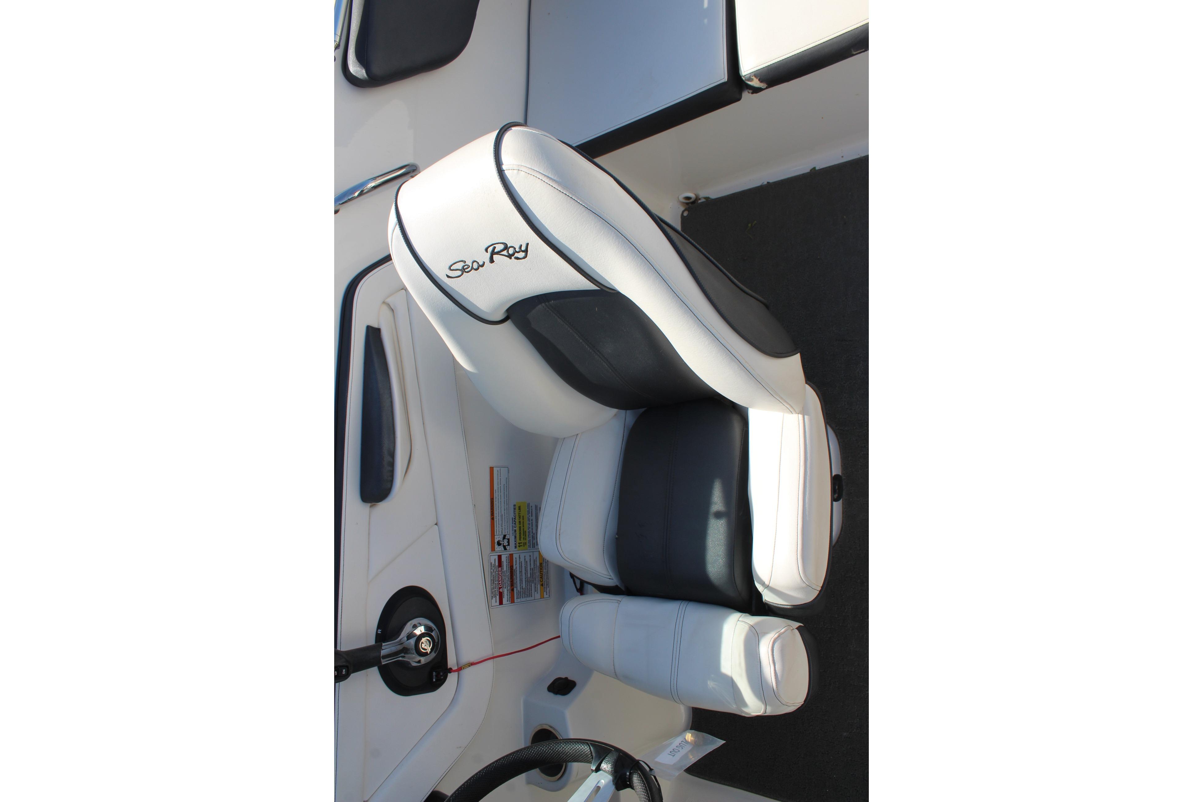 Captain's seat of 2015 Sea Ray 19 SPX OB boat, featuring sleek black and white design.