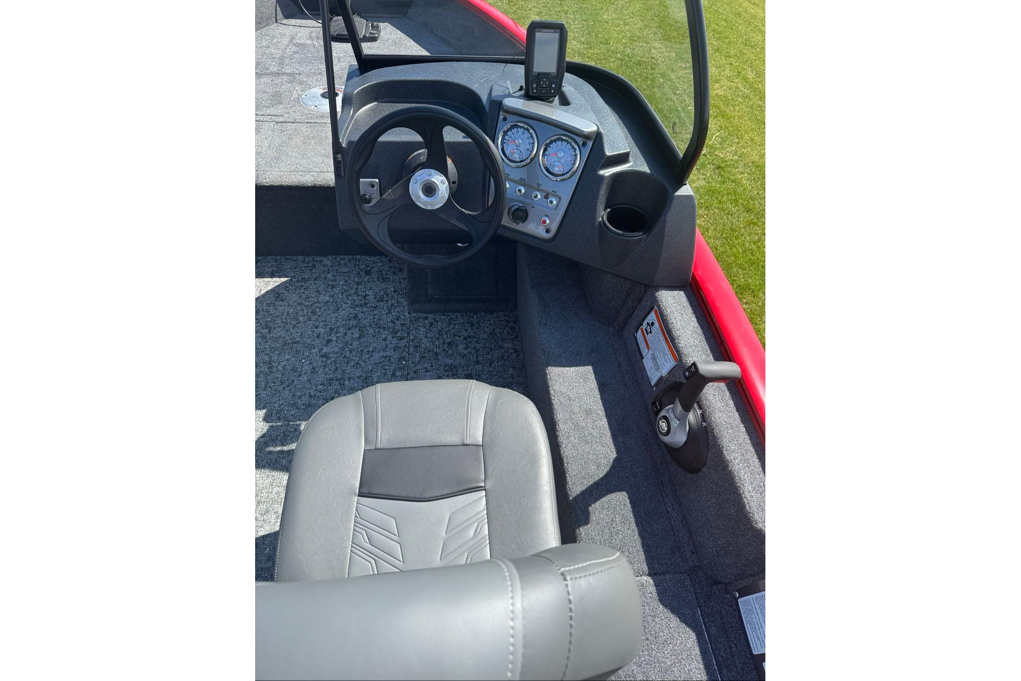 2026 Tracker Pro Guide V-16 WT boat interior with steering wheel and dashboard controls.