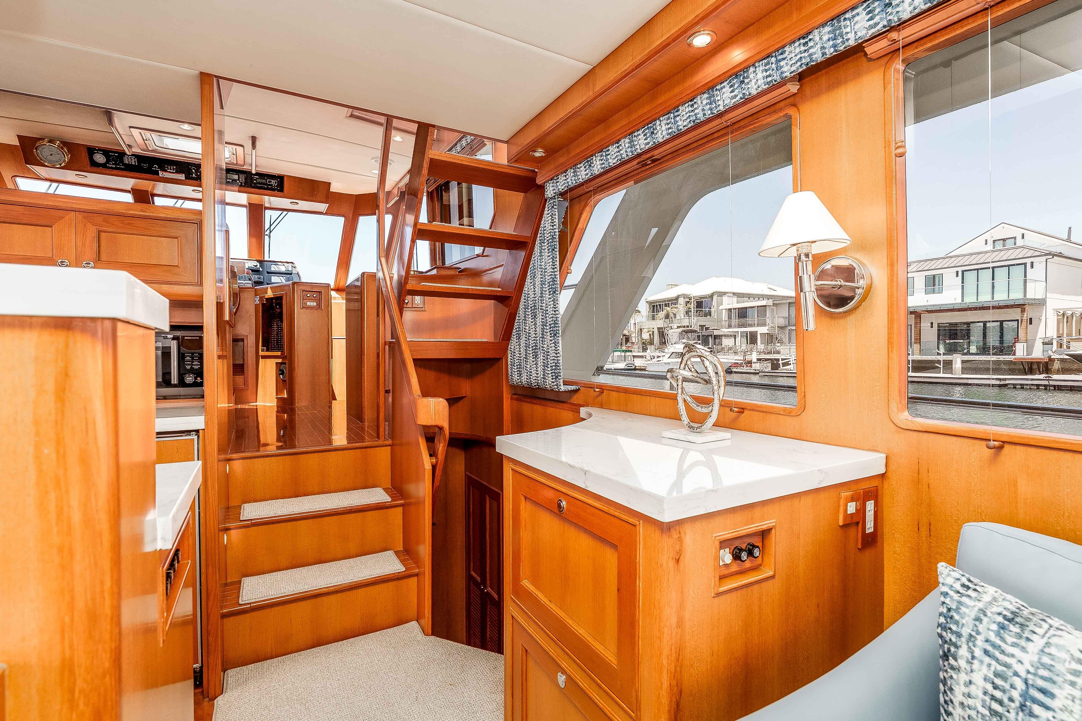 Luxurious interior of 2005 Offshore Yachts 54 Pilothouse with elegant wood finishes and modern amenities.