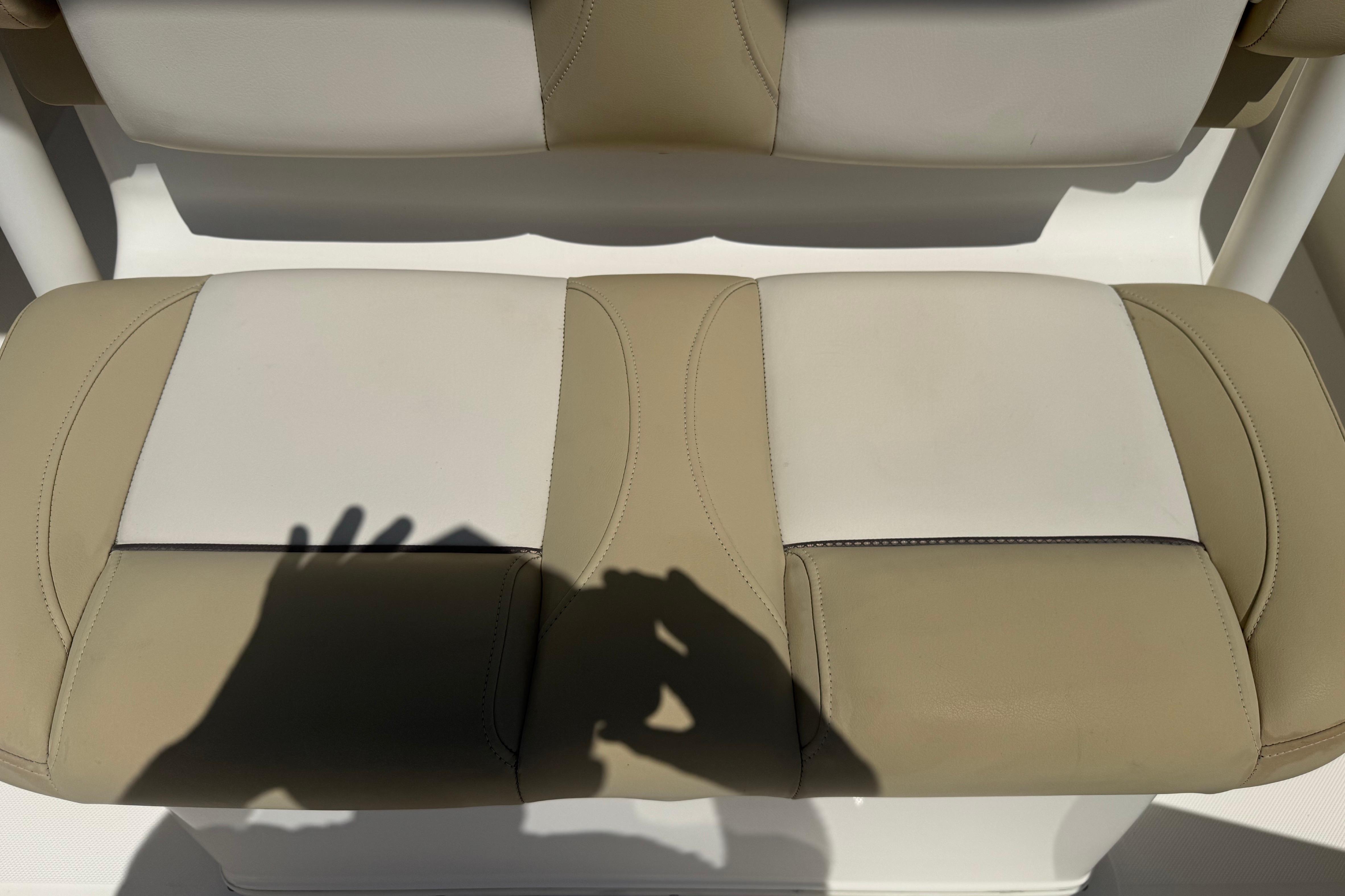 2019 Key West Billistic 281 Center Console seat with beige and white upholstery.