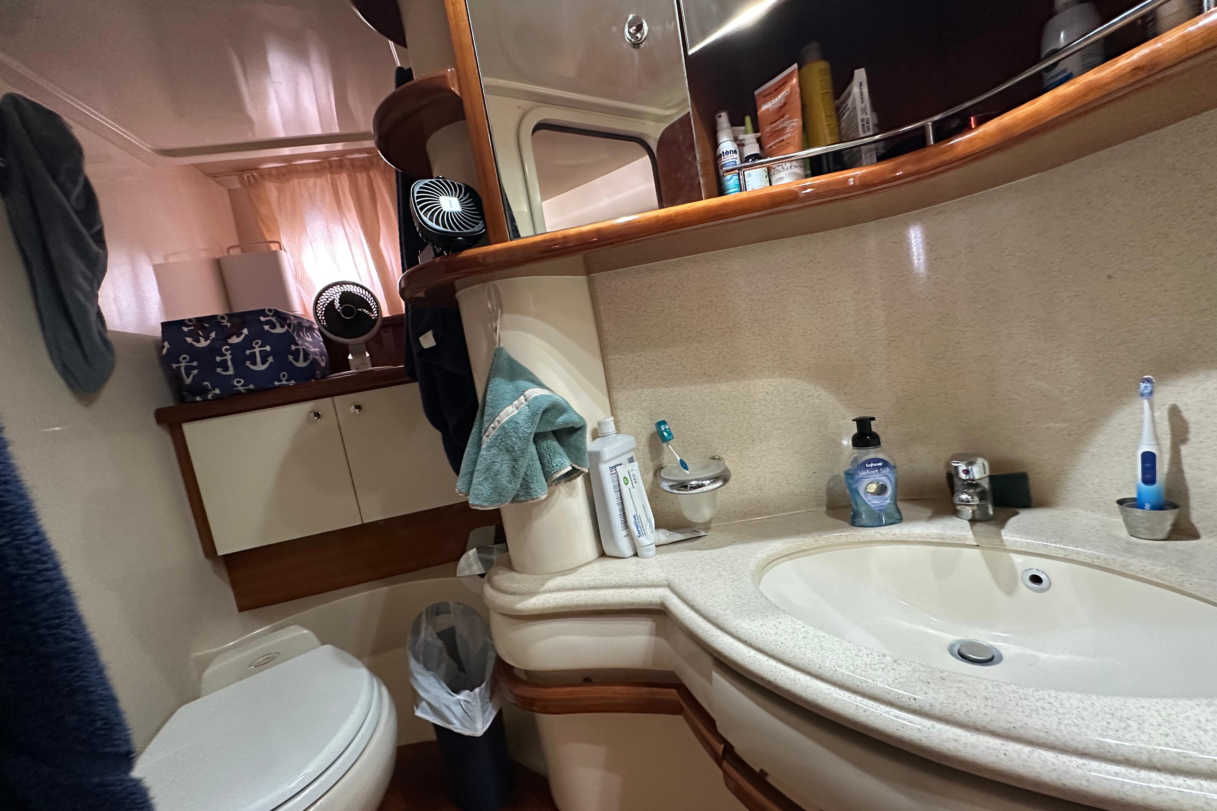 Luxurious 2004 Azimut 55E yacht bathroom with modern amenities and elegant design.