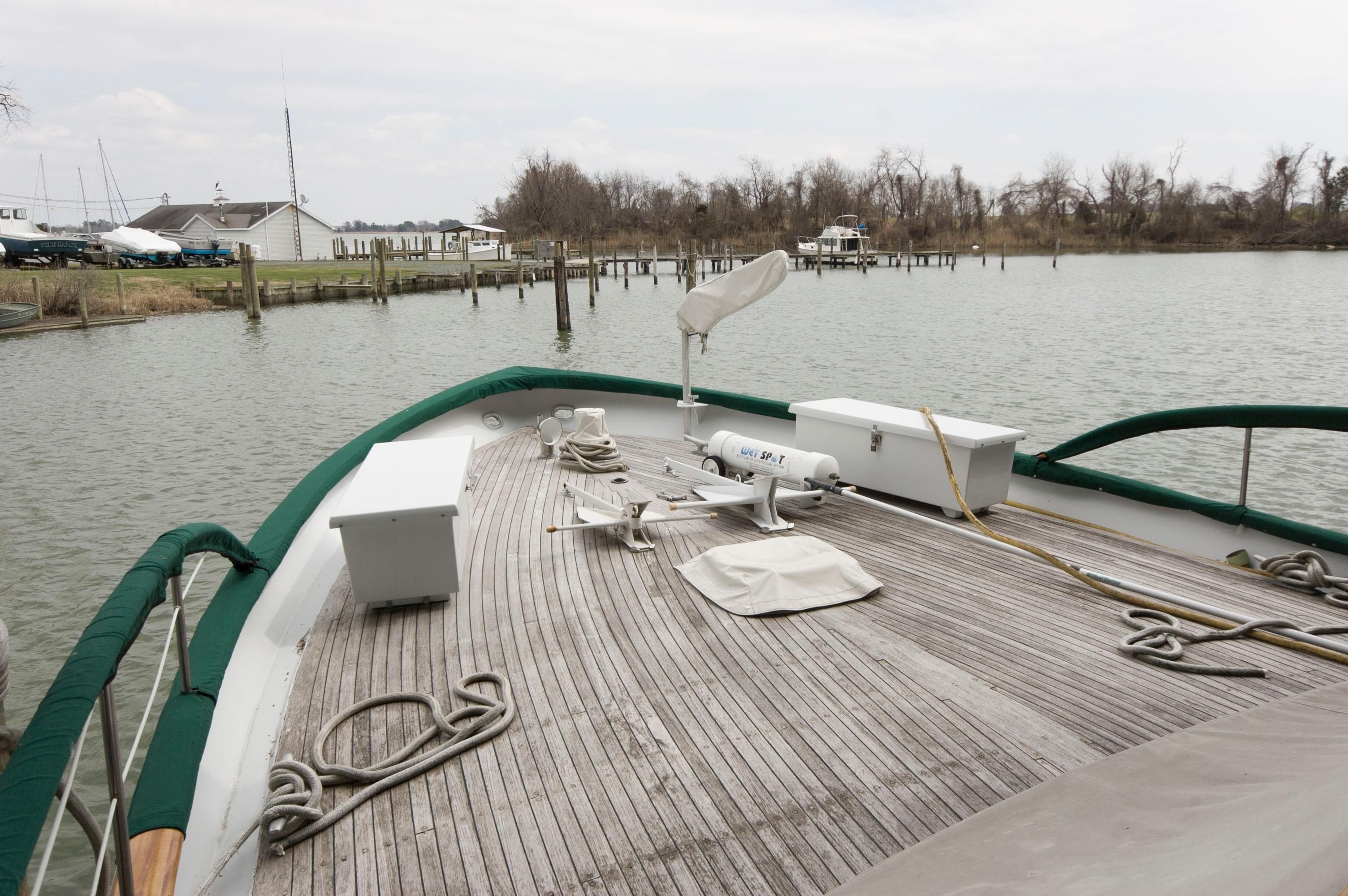 1963 Burger Flush Deck yacht on calm water.
