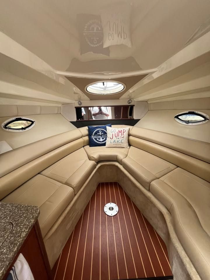 Interior of a 2011 Monterey 280SCR boat with beige seating.