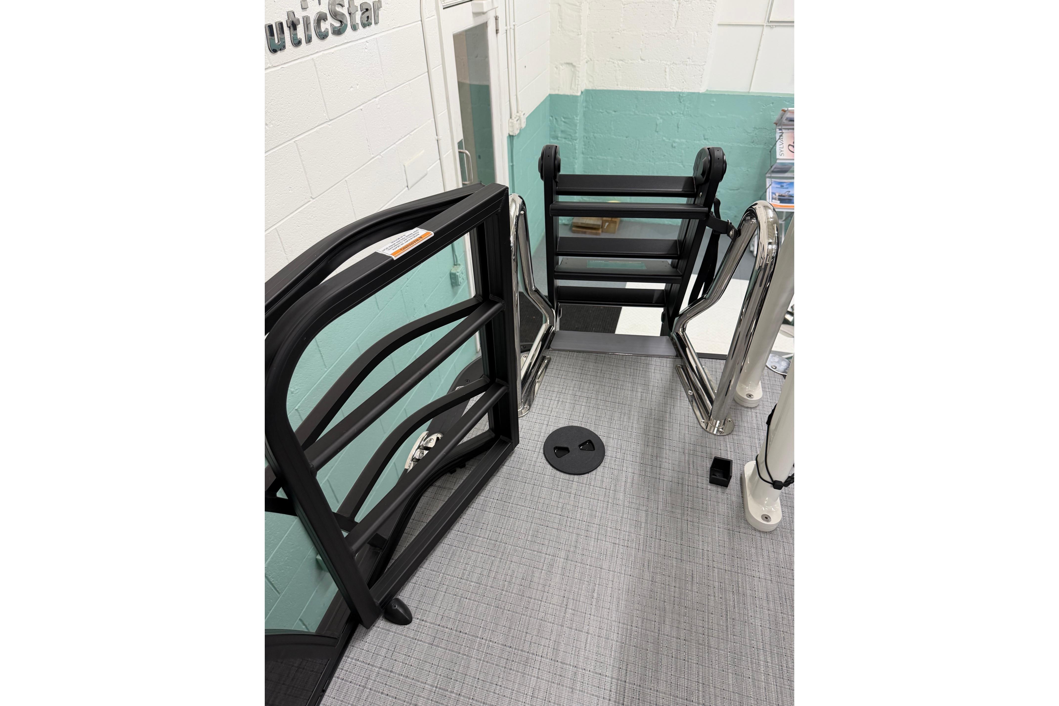 2026 South Bay 525SB2 boat deck with sleek black railing and ladder.