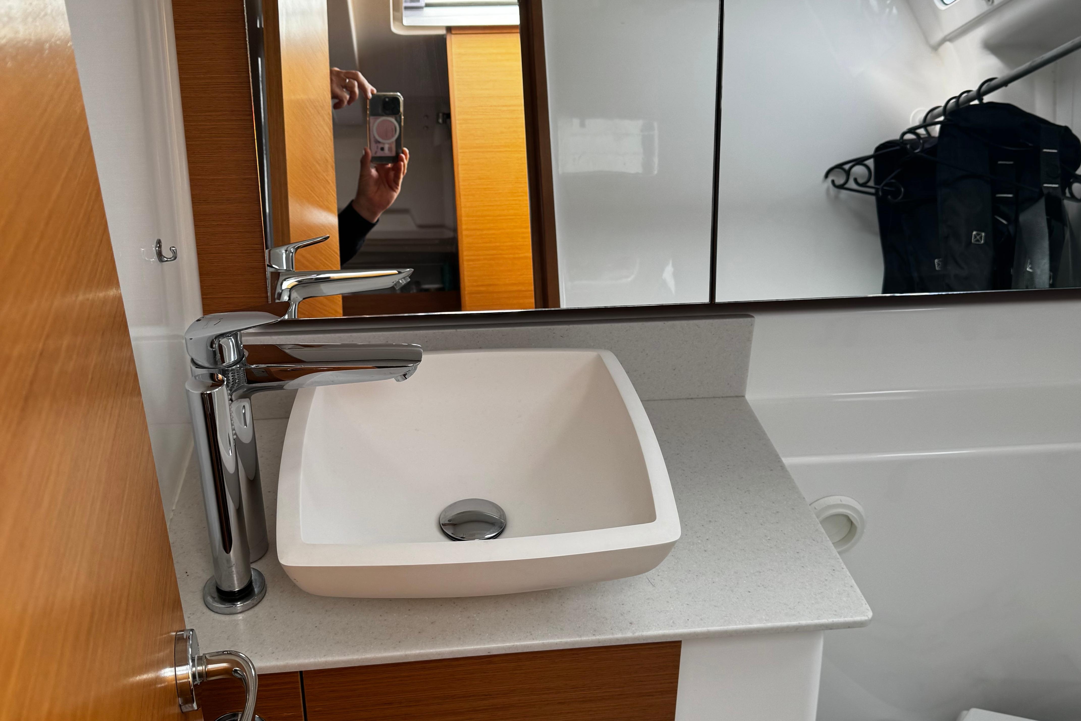 Modern bathroom sink and faucet in 2022 Dufour 32 yacht interior.